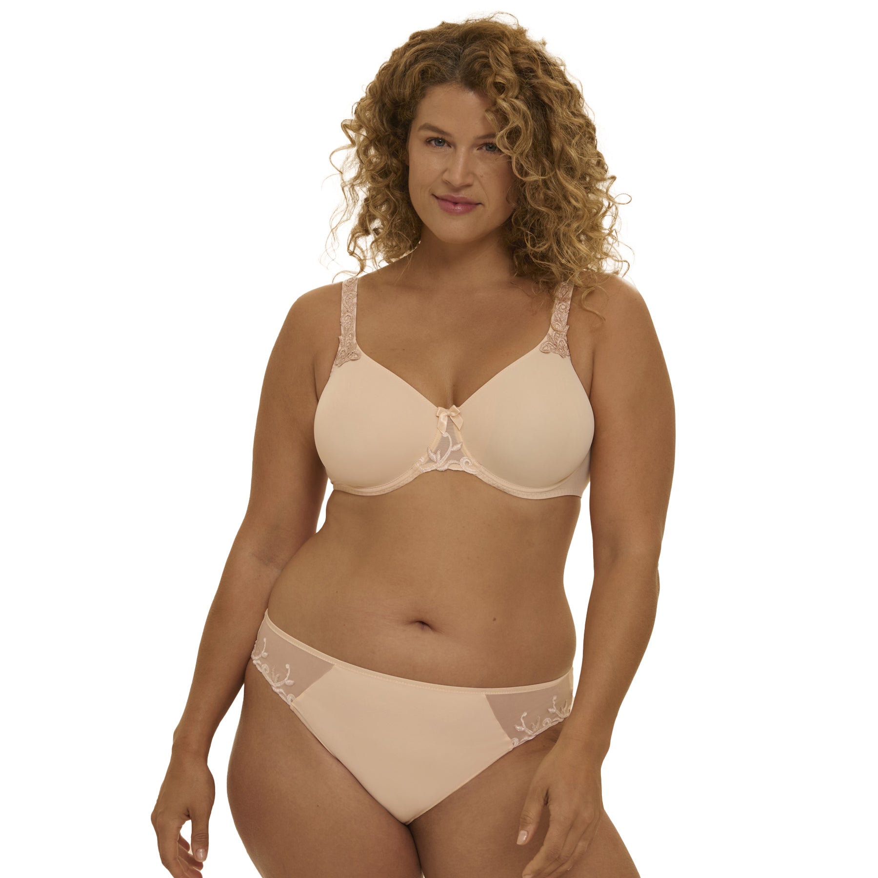 Front view of beige embroidered bra and matching full brief lingerie set on curvy model.