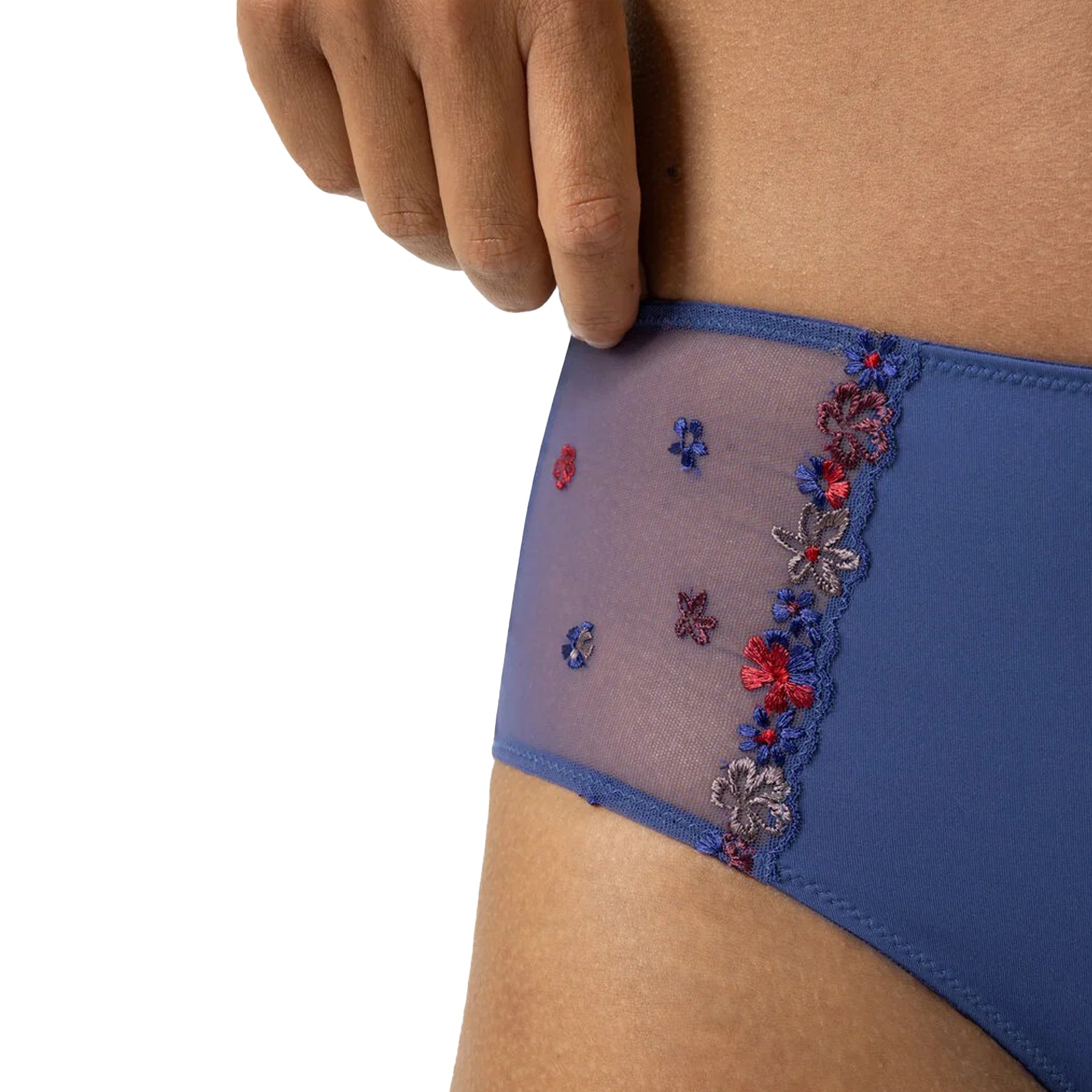 Close-up of sheer mesh side panel with red, blue, and lilac floral embroidery on high-waist blue briefs