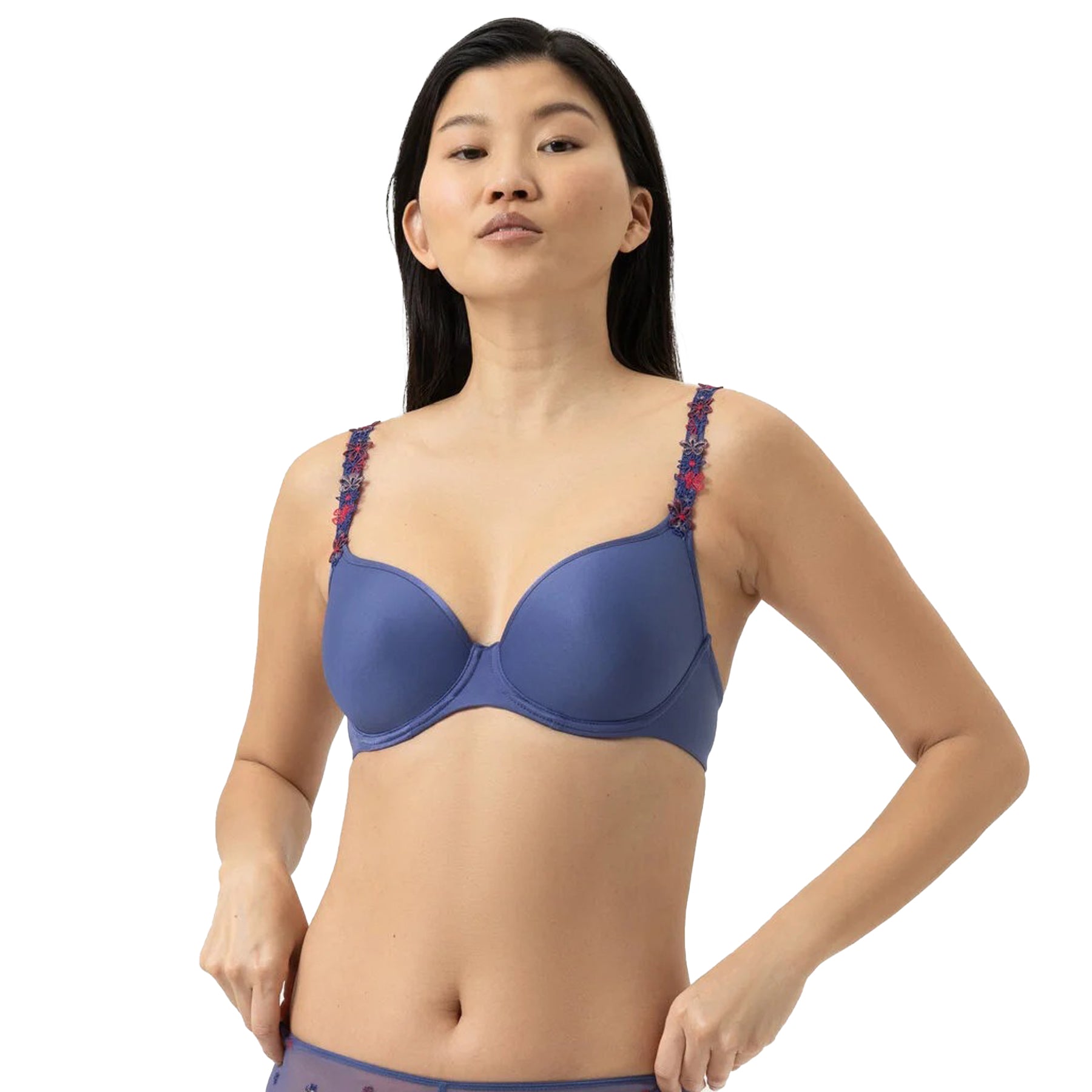 Blue spacer plunge bra with smooth cups and floral embroidered straps, front view on model