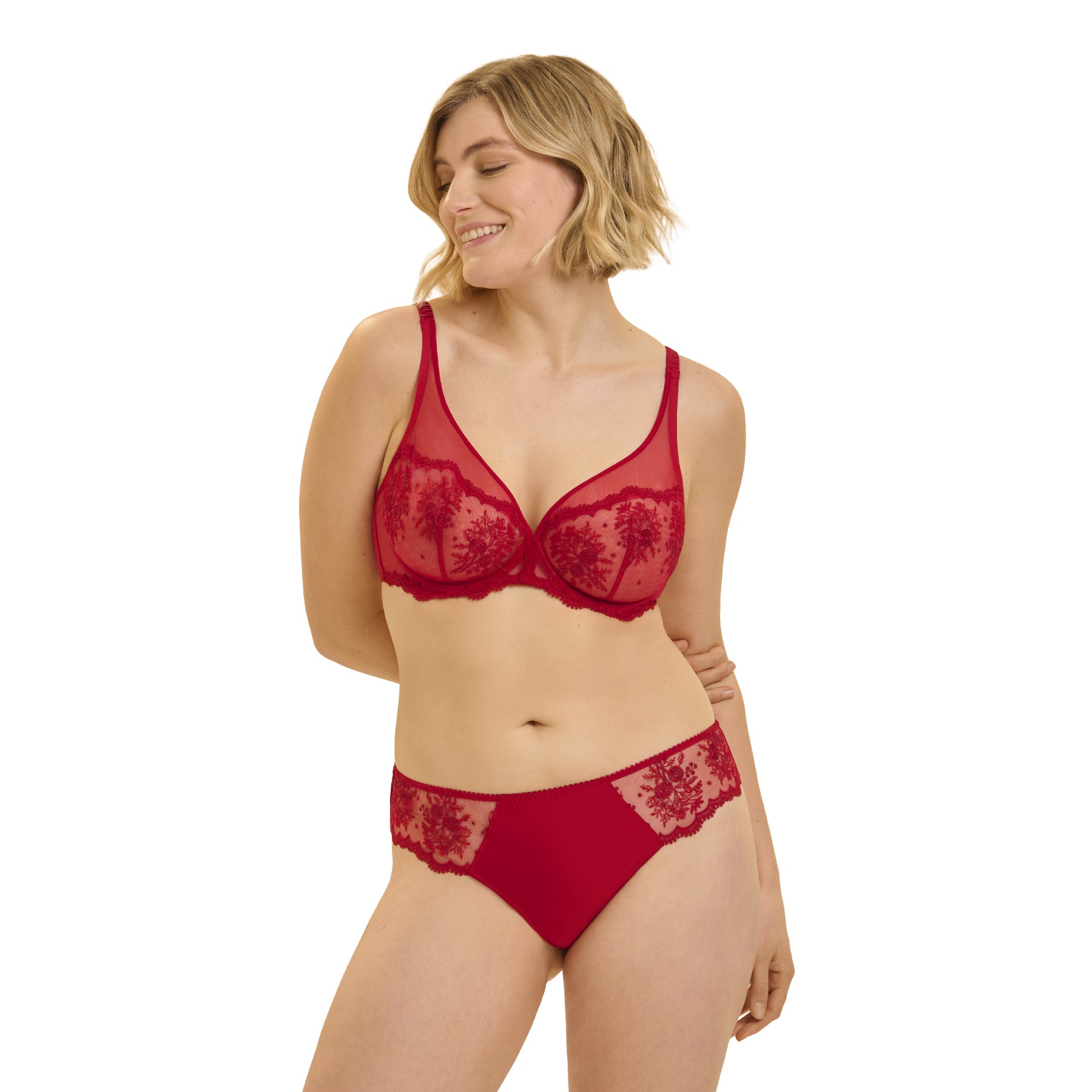 Model wearing Simone Pérèle Opera Red plunge bra with transparent embroidered cups and matching bikini brief.