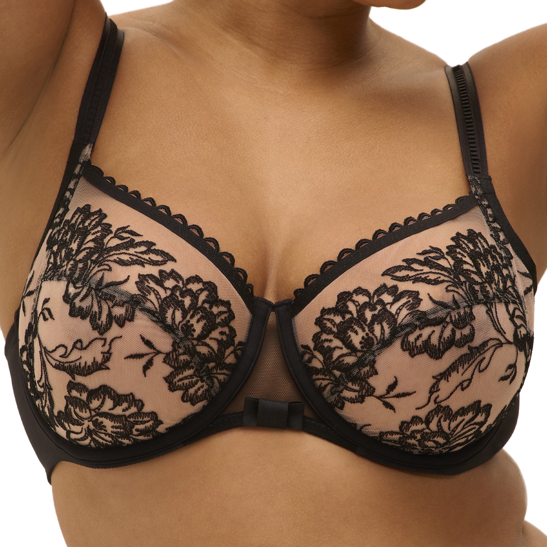 Close-up of black floral embroidery and scalloped edge detailing on full cup bra with sheer mesh.