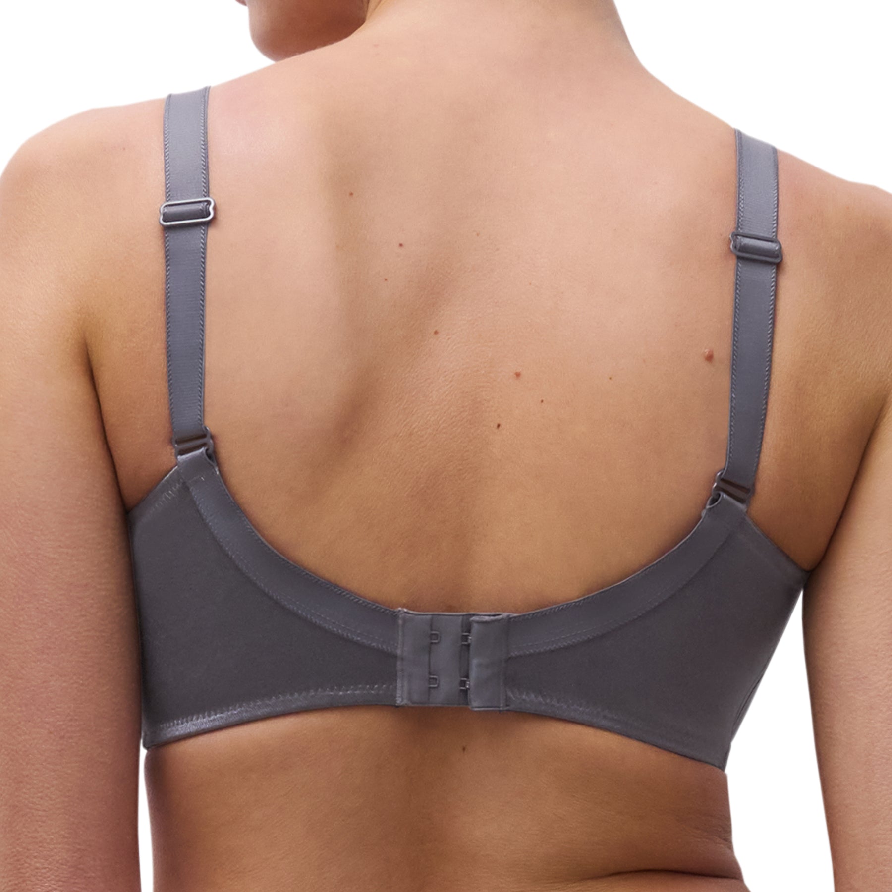 Close-up of the back of the slate grey seamless bra with adjustable straps and hook-and-eye closure.