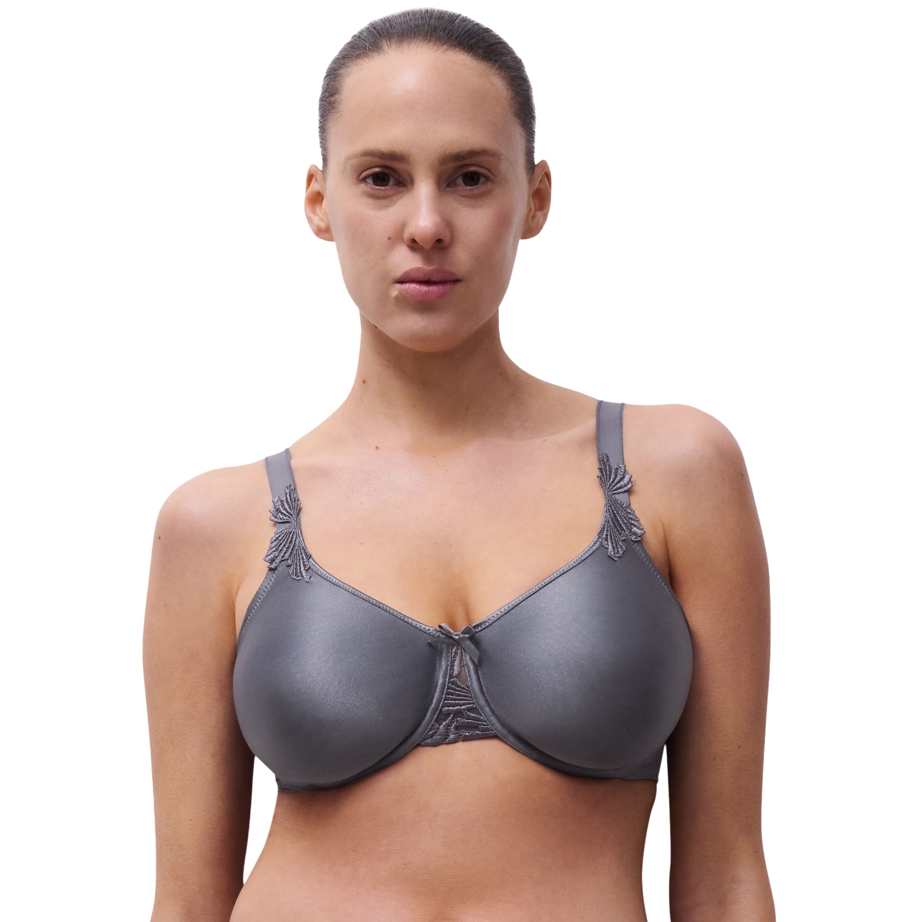 Frontal close-up of woman wearing seamless slate grey bra with satin finish and embroidered trim