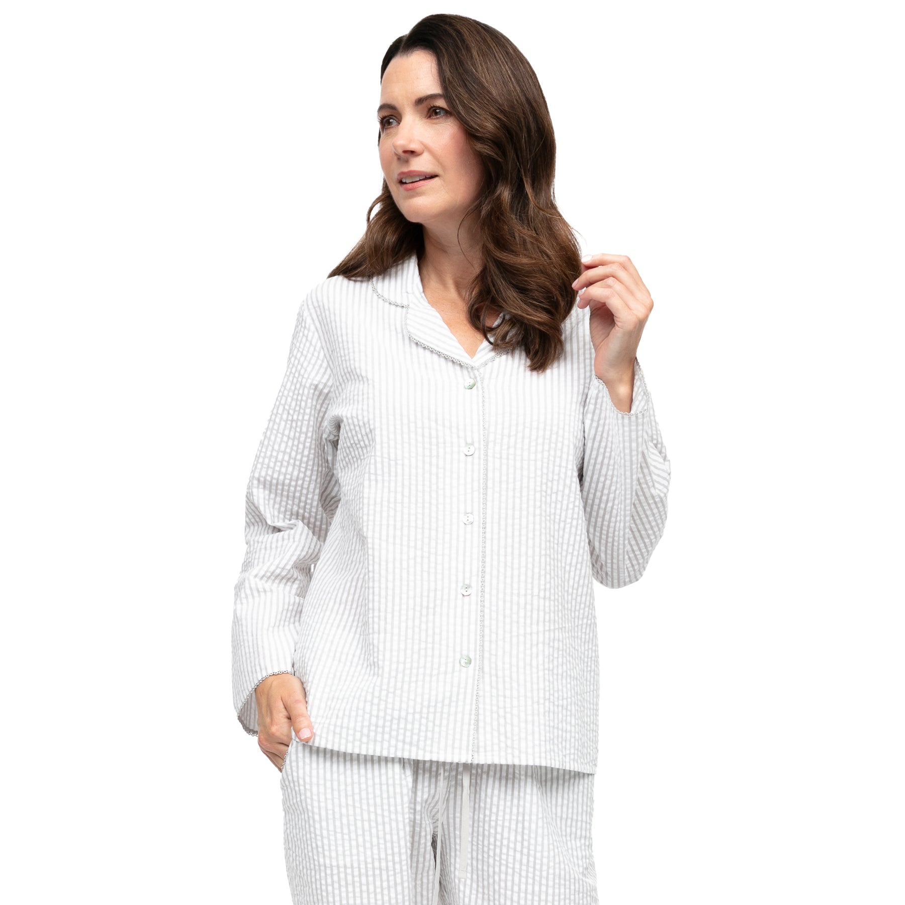 Close-up of light grey and white striped cotton pyjama top showing collar detail, front buttons, and subtle textured fabric.