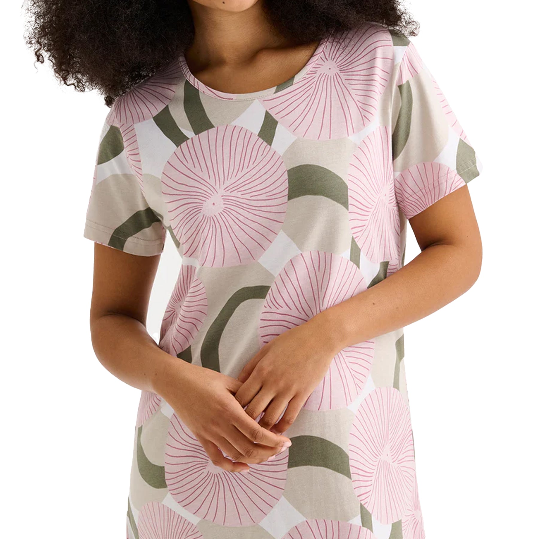 Close-up of pink circular floral print short-sleeve chemise with round neckline on model.