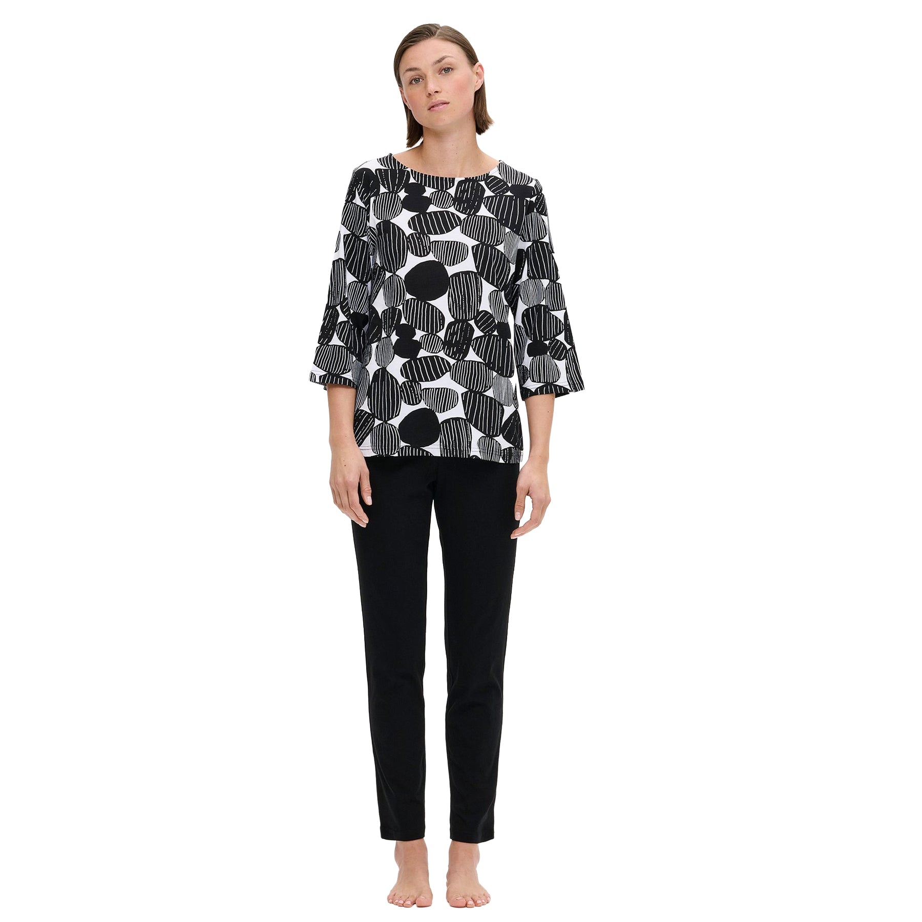 Nanso black long-sleeve pyjama set with abstract stone print top and solid black pants, full-length view on model