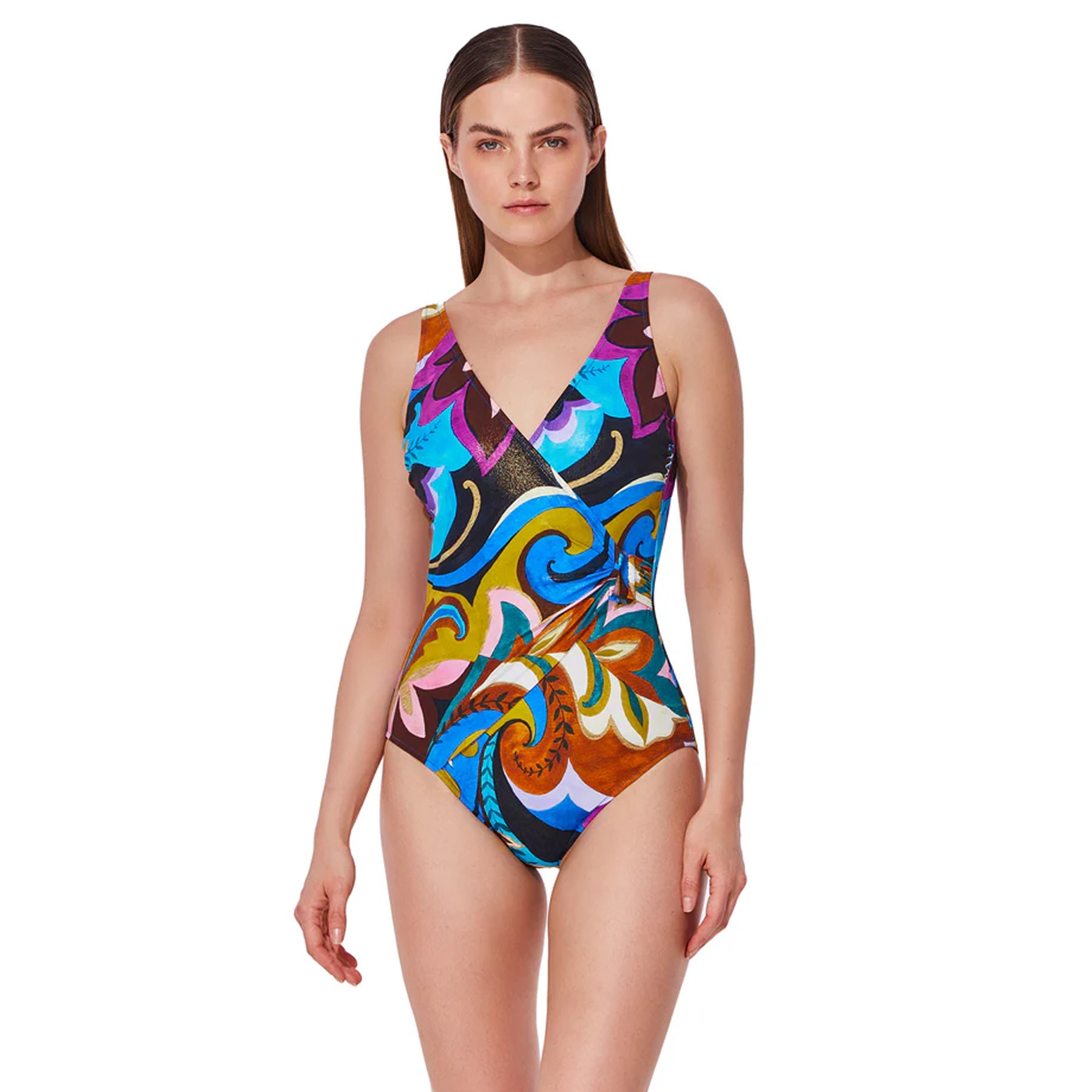 Woman wearing a V-neck one-piece swimsuit with a colourful abstract Porto print in turquoise, blue, purple, brown, and gold tones on a white background