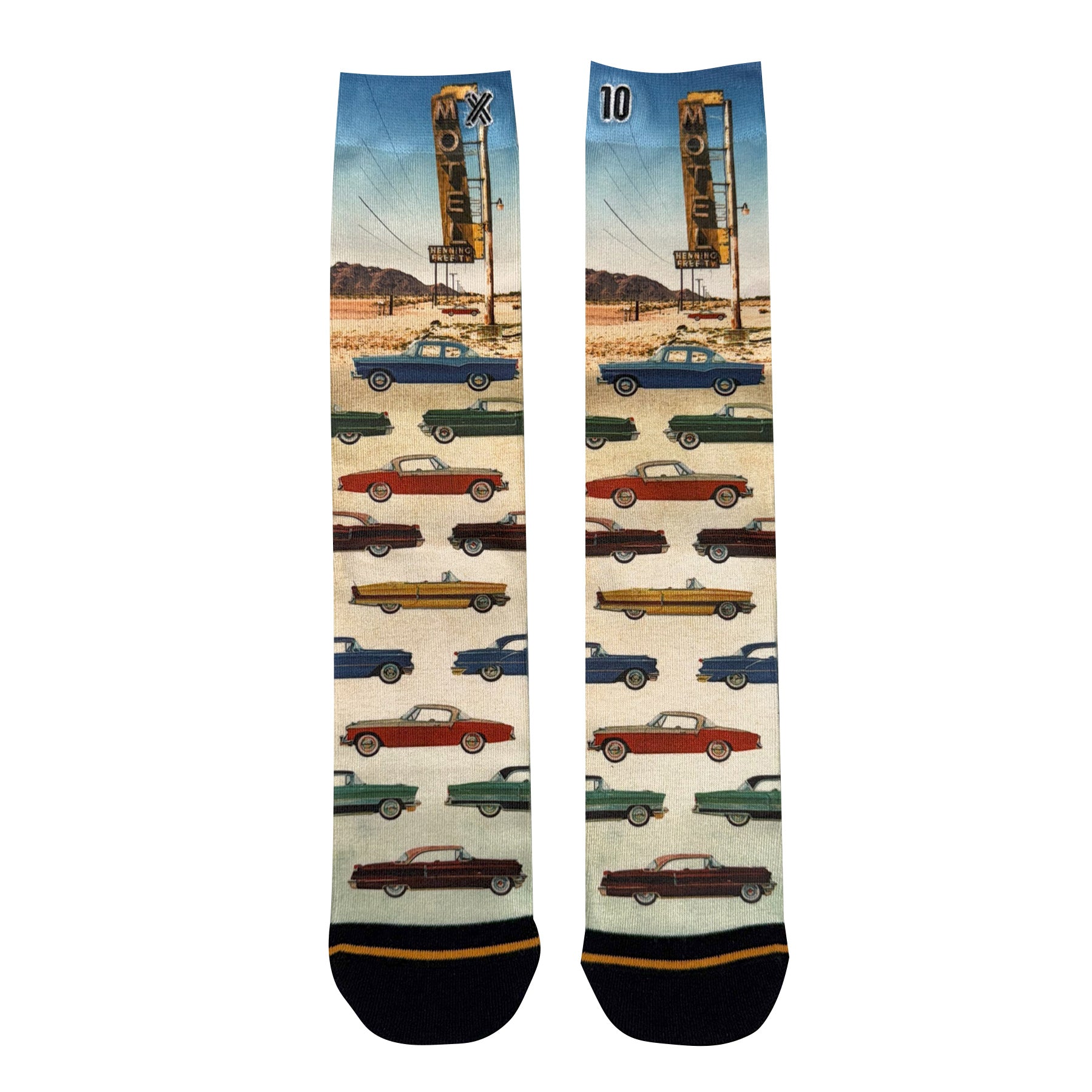 Pair of crew socks featuring a vintage car and motel print with a desert background in warm retro tones.