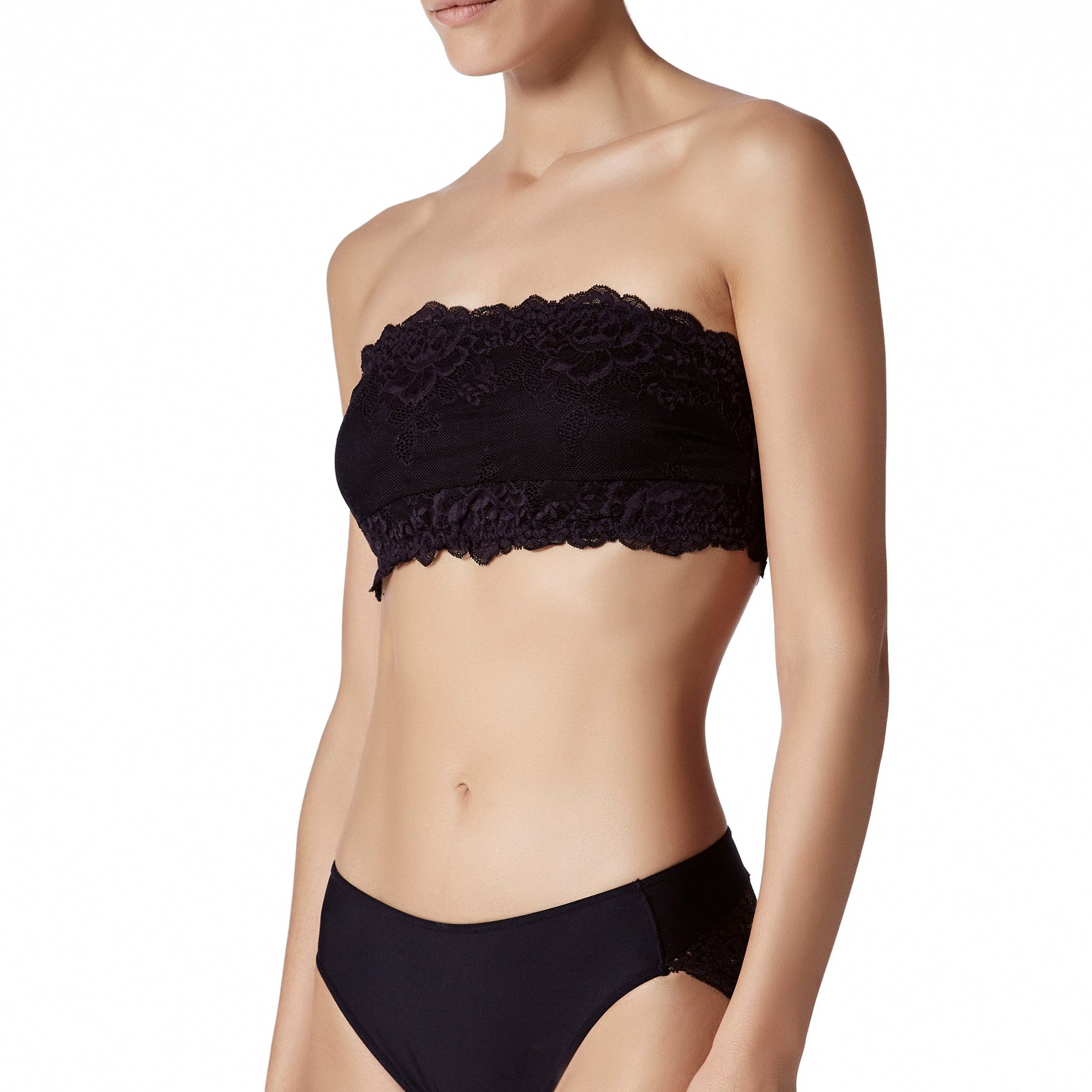 Black floral lace bandeau bra featuring a smooth seamless centre panel, strapless design, and delicate scalloped lace edging.