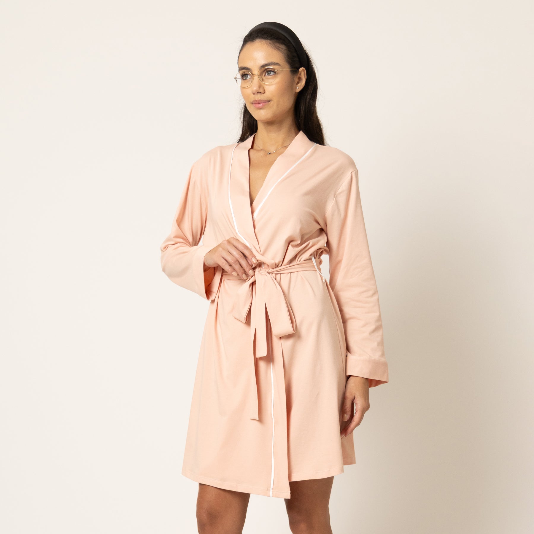 Back view of blush pink robe with long sleeves and adjustable waist tie, soft drape fabric