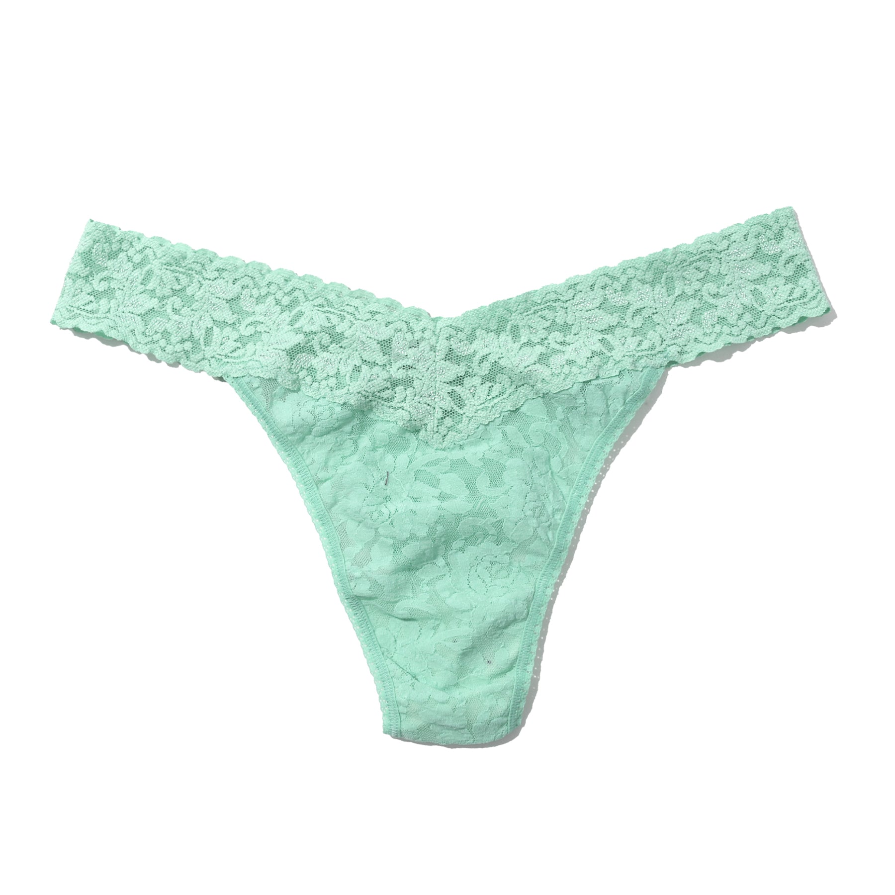 Flat lay of a mint lace thong displayed on a white background, showing the delicate floral lace and clean finish.