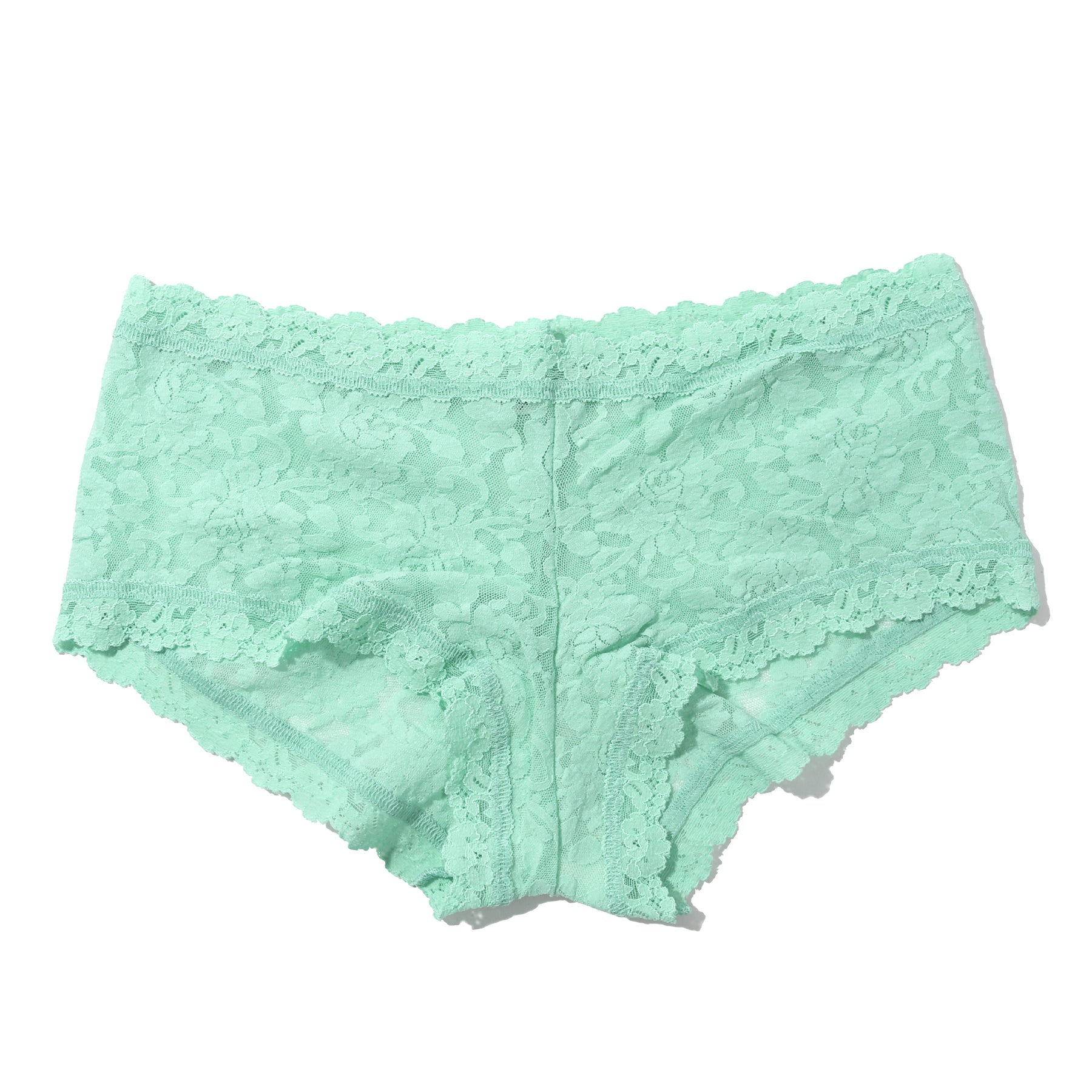 Flat lay of mint lace boyshort underwear on a white background, highlighting the floral lace pattern and delicate scalloped edges.