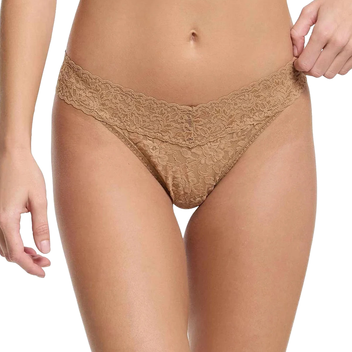 Model wearing the Hanky Panky Signature Lace Original Rise Thong in Suntan beige, featuring delicate floral lace, a wide scalloped waistband, and a flattering V-shaped front.