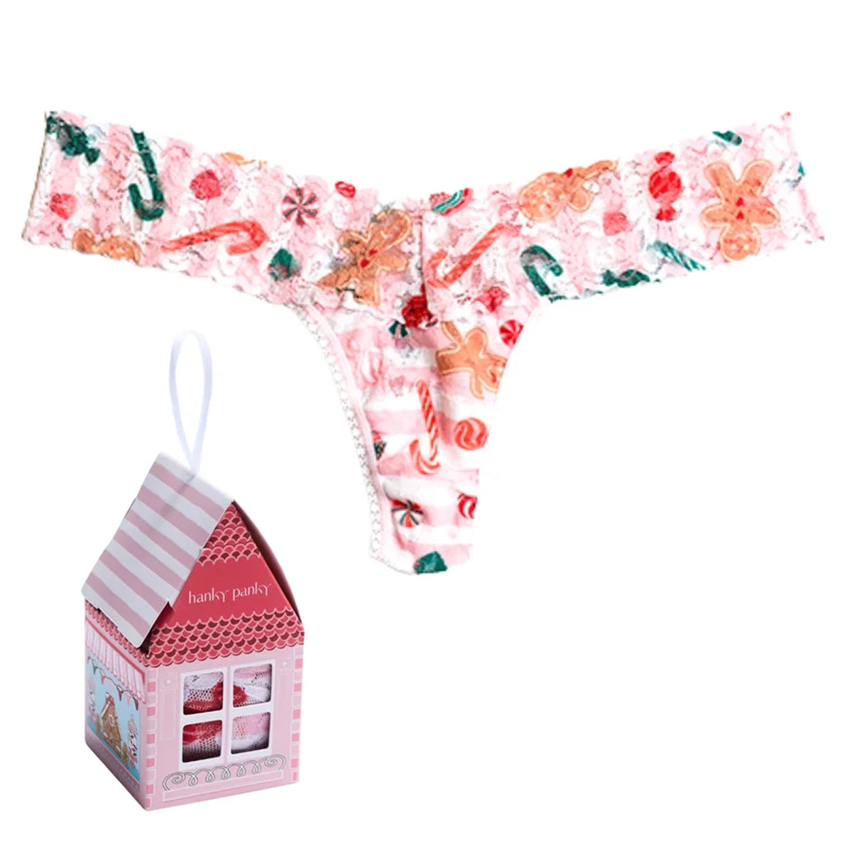 Hanky Panky Signature Lace Low Rise Thong in Sugar and Spice holiday print, featuring pink floral lace with gingerbread cookies, candy canes, and peppermint candies, displayed with a pink gingerbread house gift box.