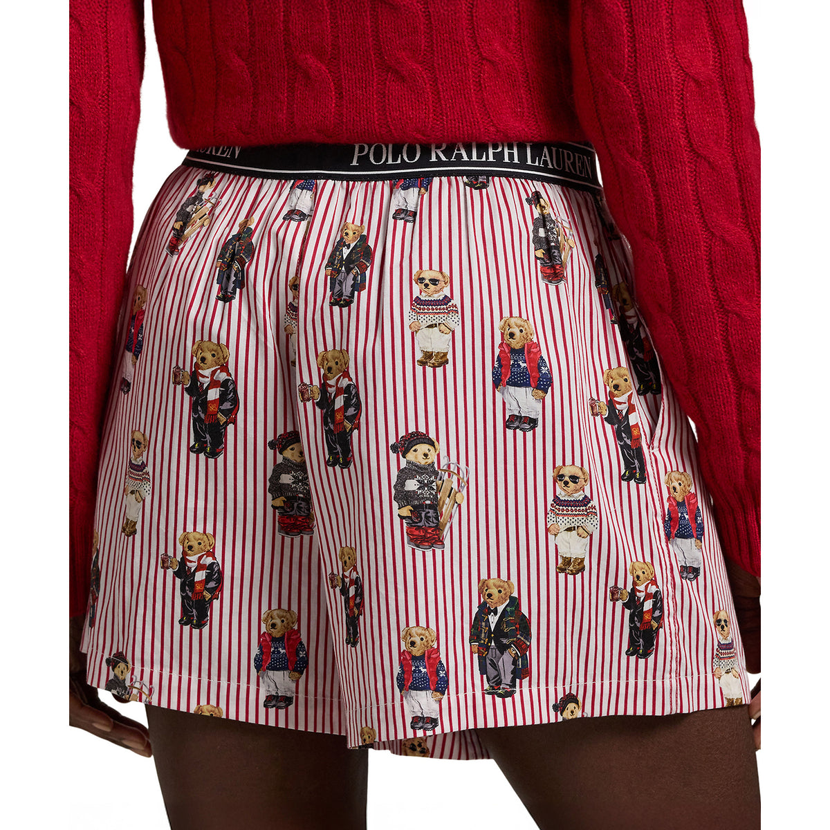 Rear view of Polo Ralph Lauren women's boxer sleep shorts featuring a relaxed fit, red and white vertical stripes, playful Polo Bear illustrations, and a black branded waistband.