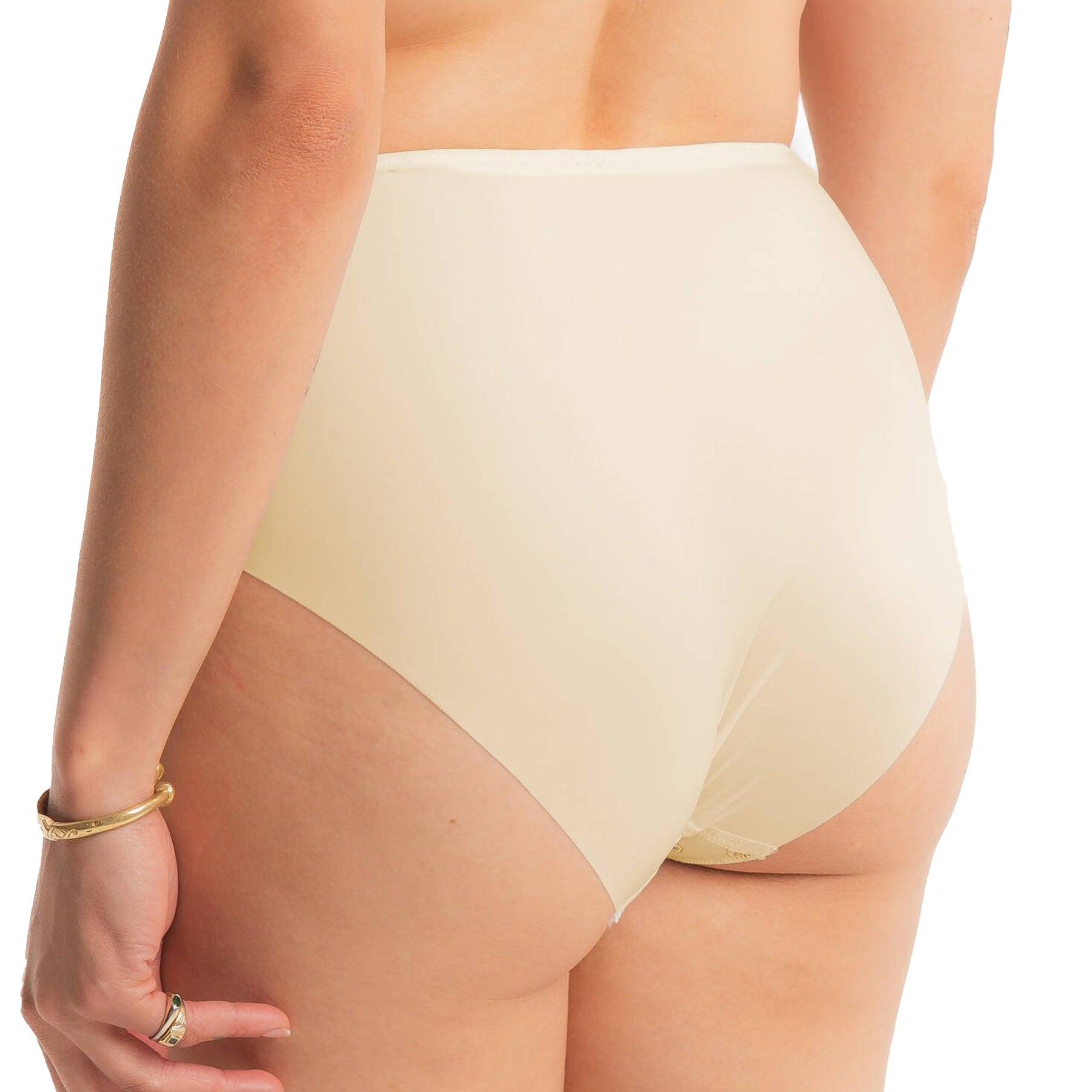 Rear view of the panty showing its smooth, opaque cream back panel offering full coverage with a seamless finish.