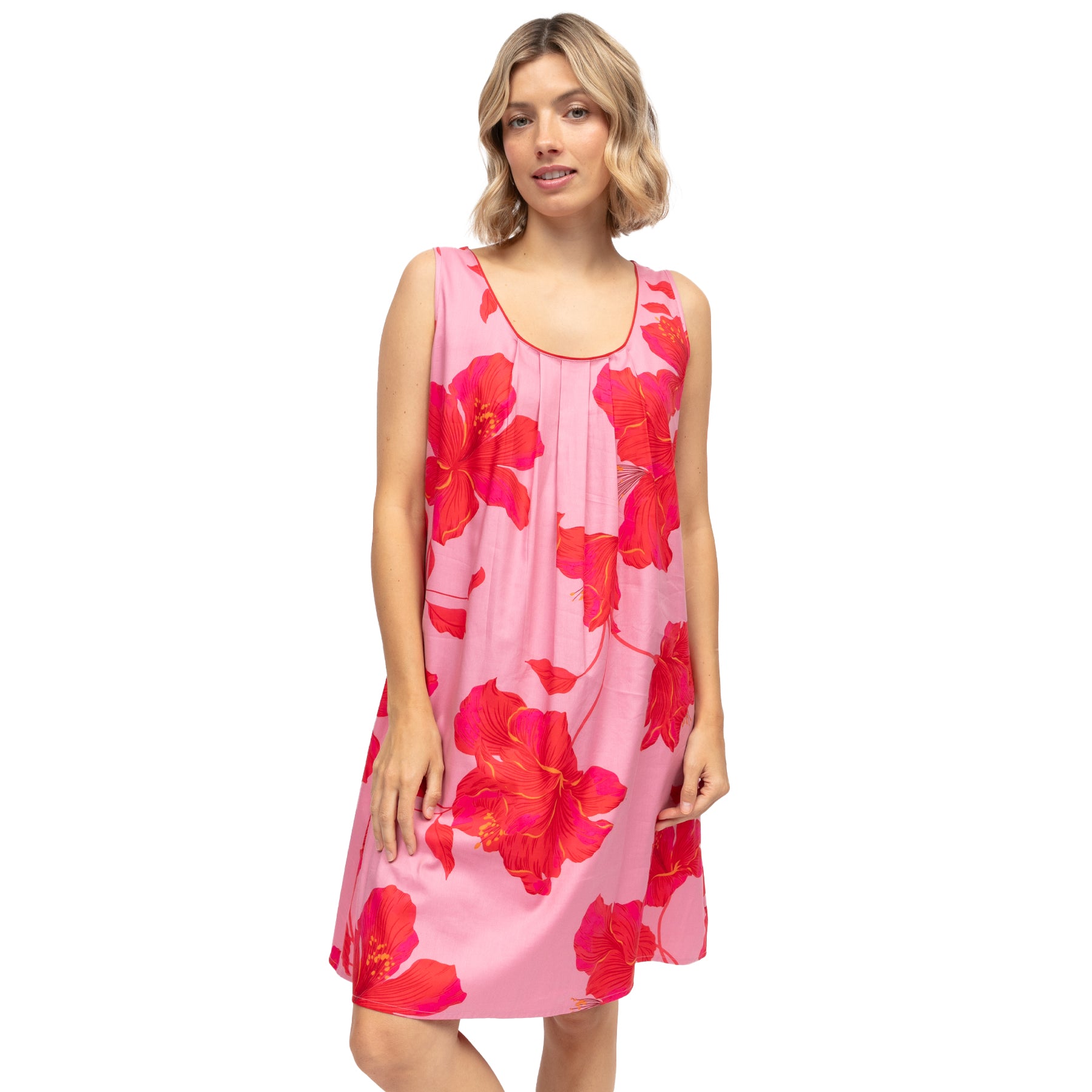 Model wearing pink sleeveless floral chemise with red hibiscus print, lightweight relaxed fit sleep dress