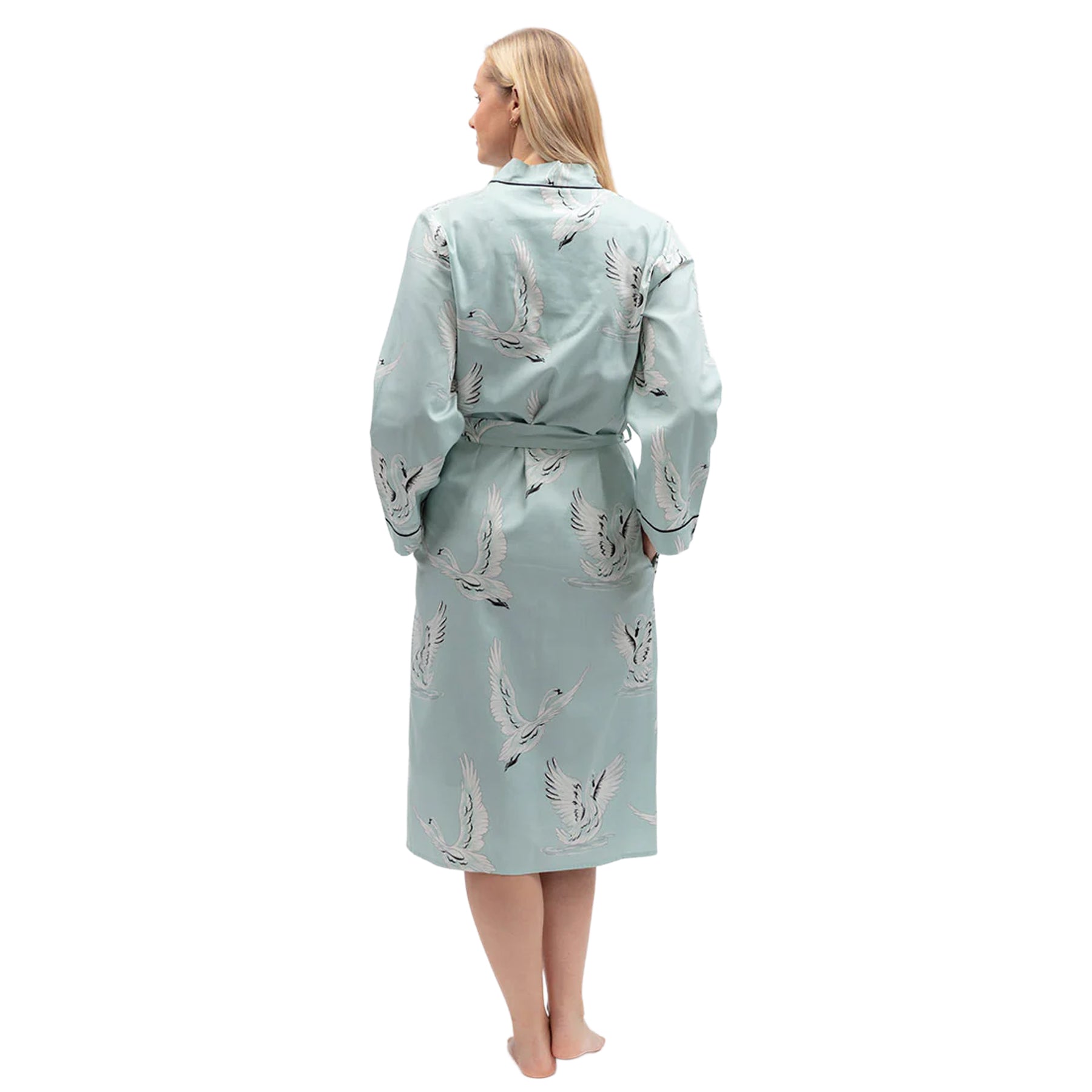 Back view of mint blue swan print robe showcasing relaxed fit, long sleeves and matching waist tie.