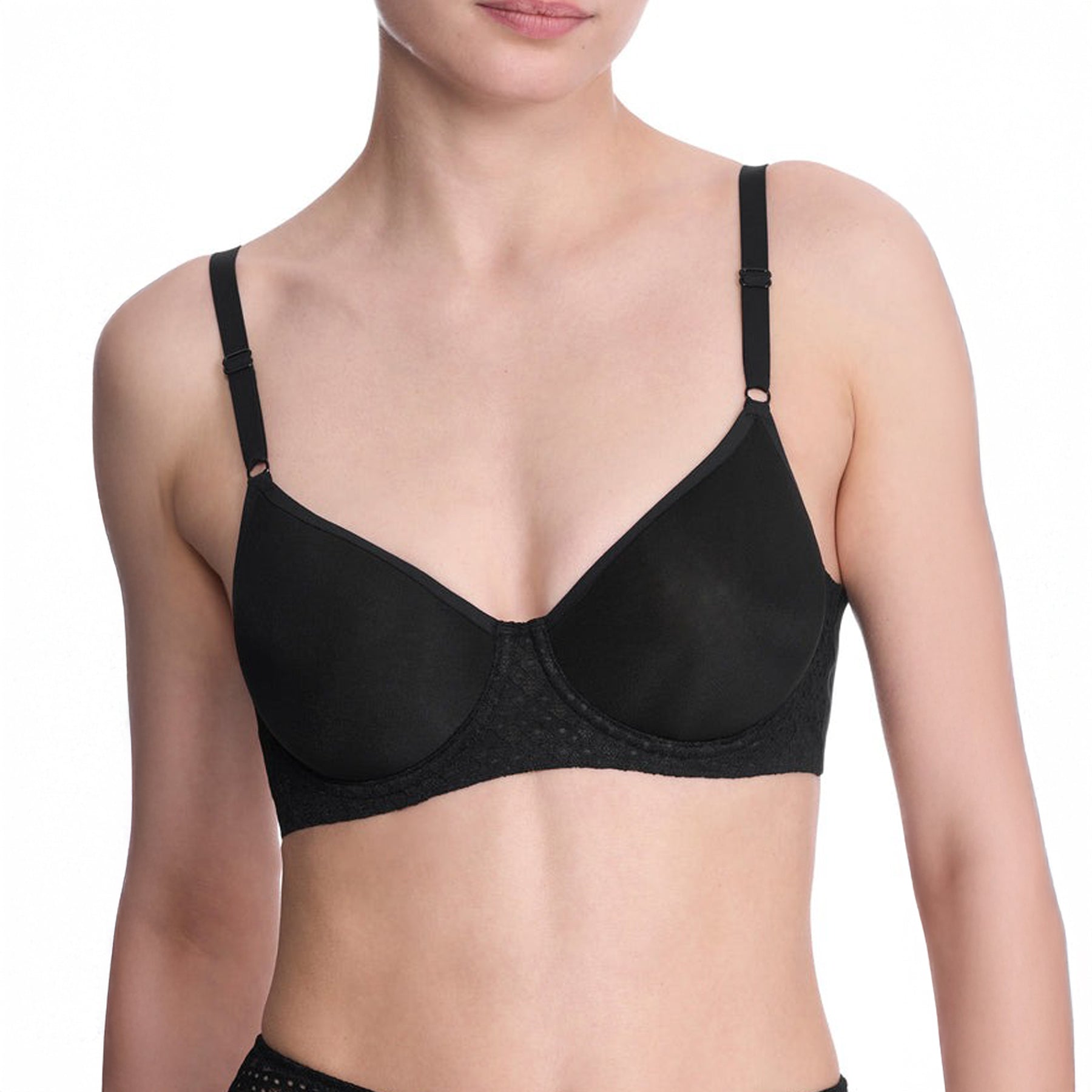 Front close-up of black spacer bra worn by model - soft cups and lace underband.