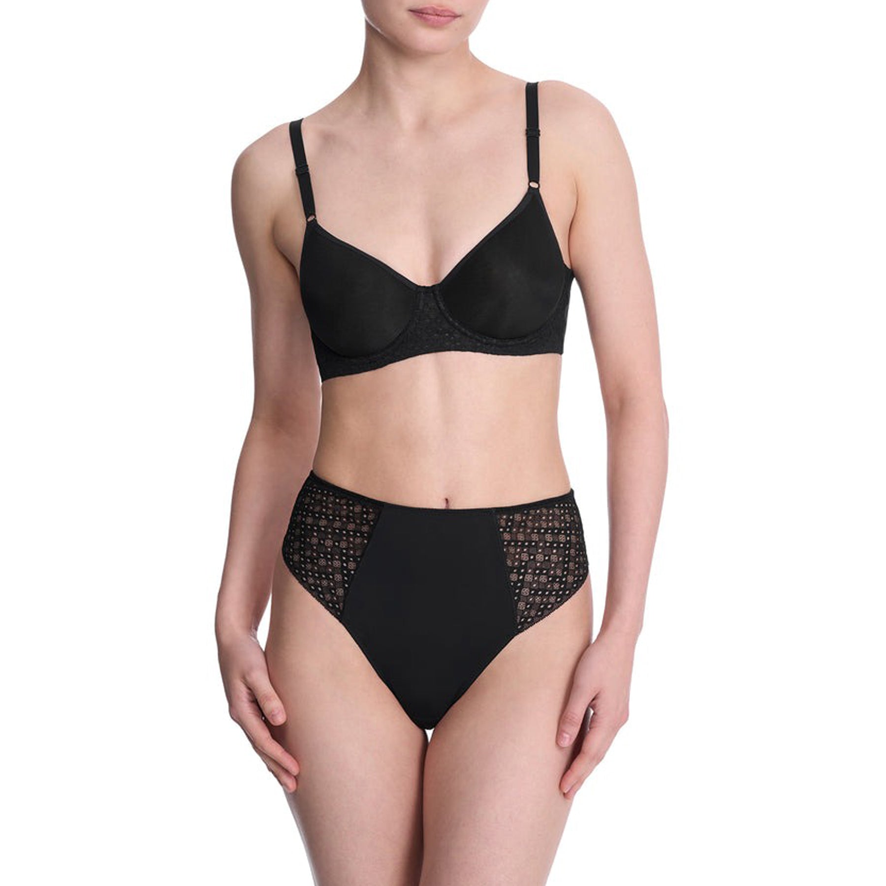 Model wearing matching black spacer bra and high-waisted brief set with lace panels.