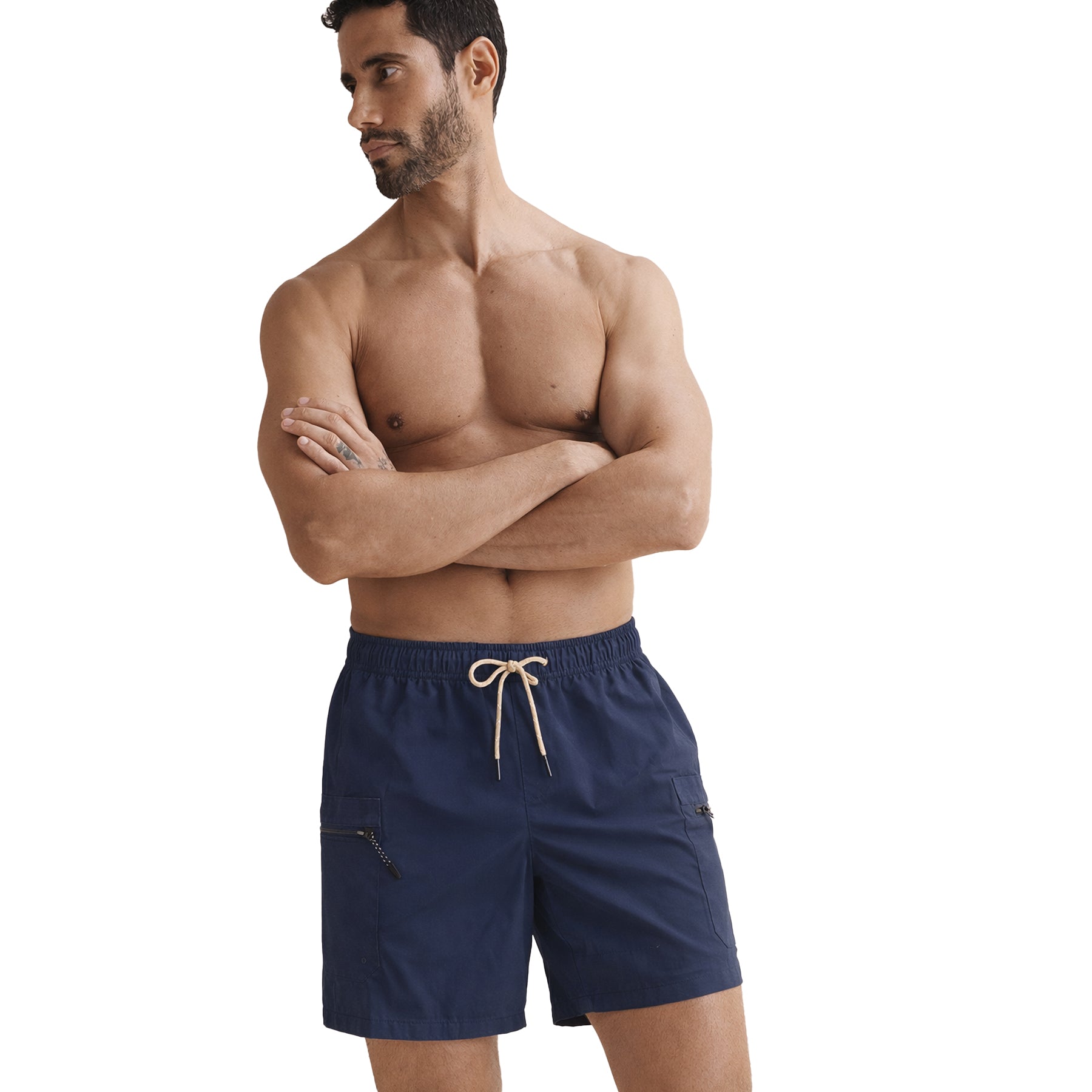 Fit male model wearing navy swim shorts with drawstring waist and functional zip cargo pockets.