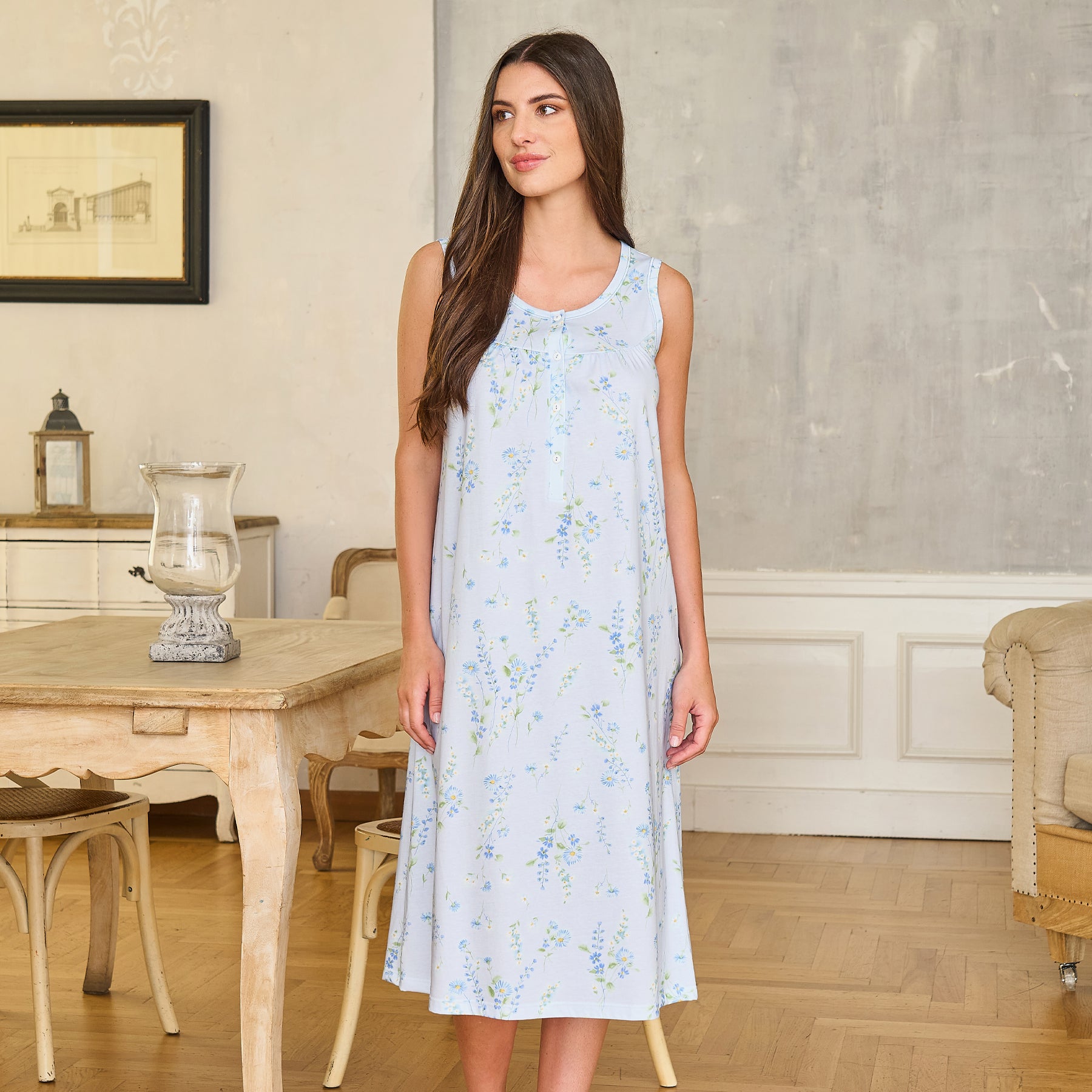 Light blue sleeveless nightgown with delicate floral print, button-front neckline, and relaxed midi-length silhouette in a soft drape