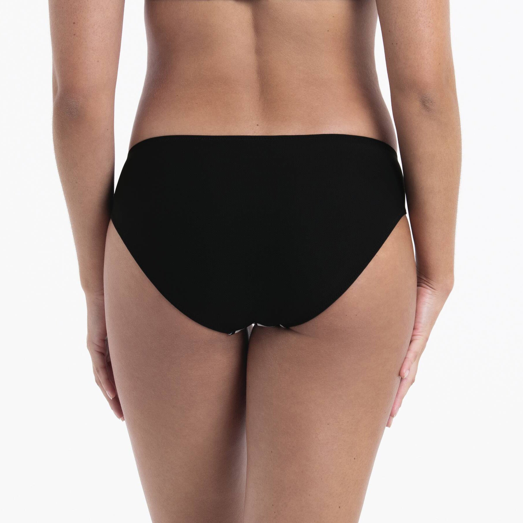 Black bikini swim bottom, back view, smooth stretch fabric with clean seamless finish and mid-rise coverage.