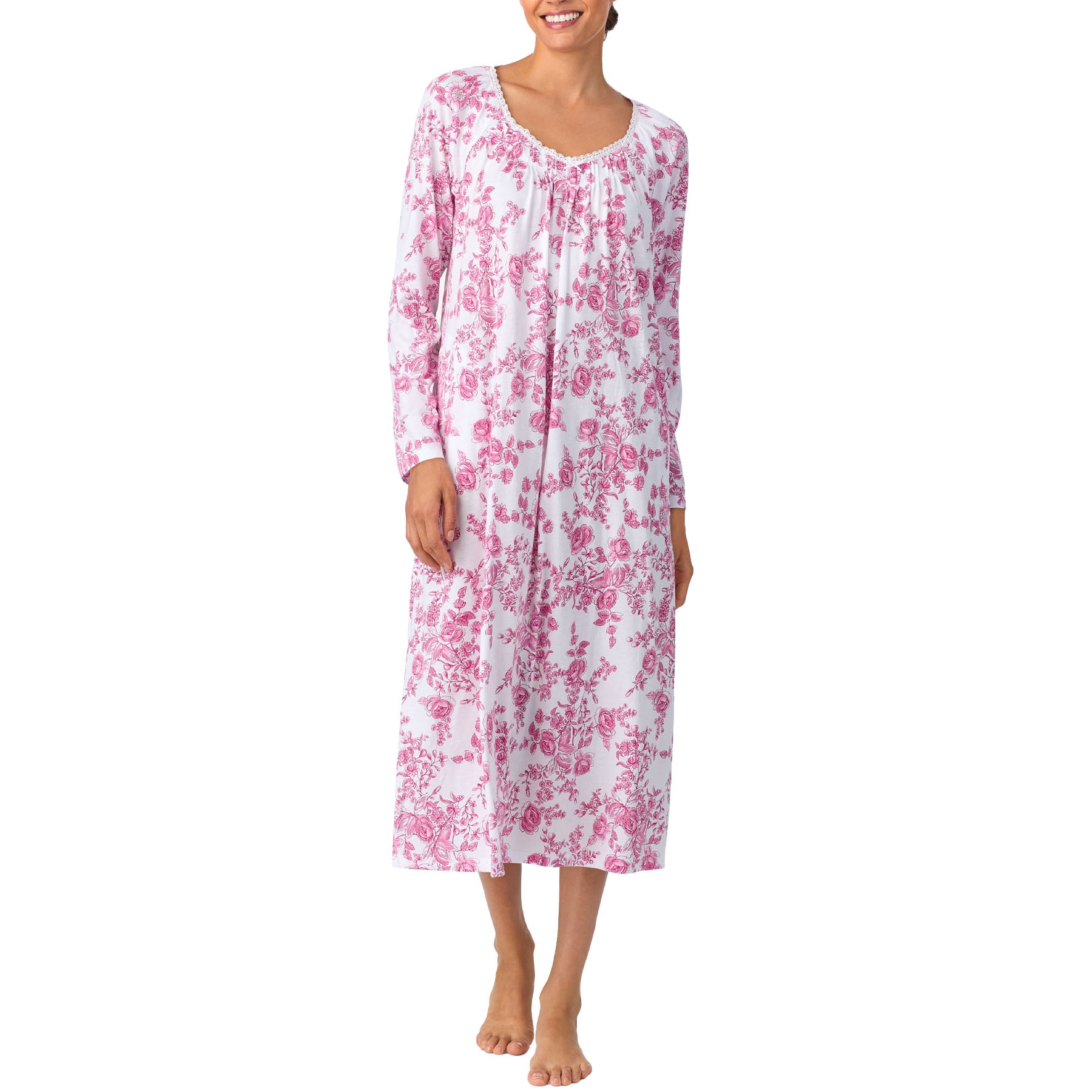 Woman wearing a pink floral nightgown on a white background