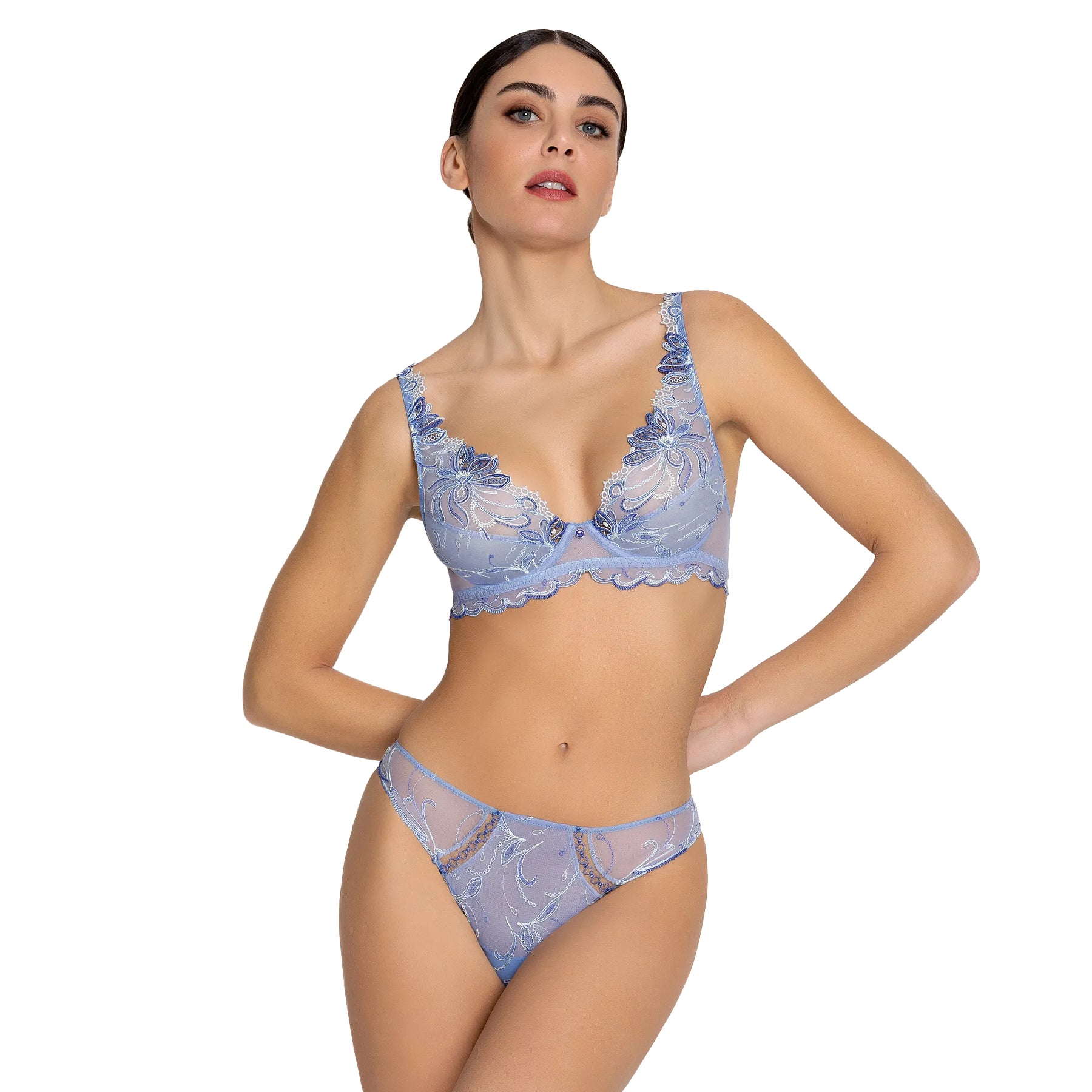 Front view of model wearing light blue embroidered Italian briefs paired with a matching sheer embroidered bra.