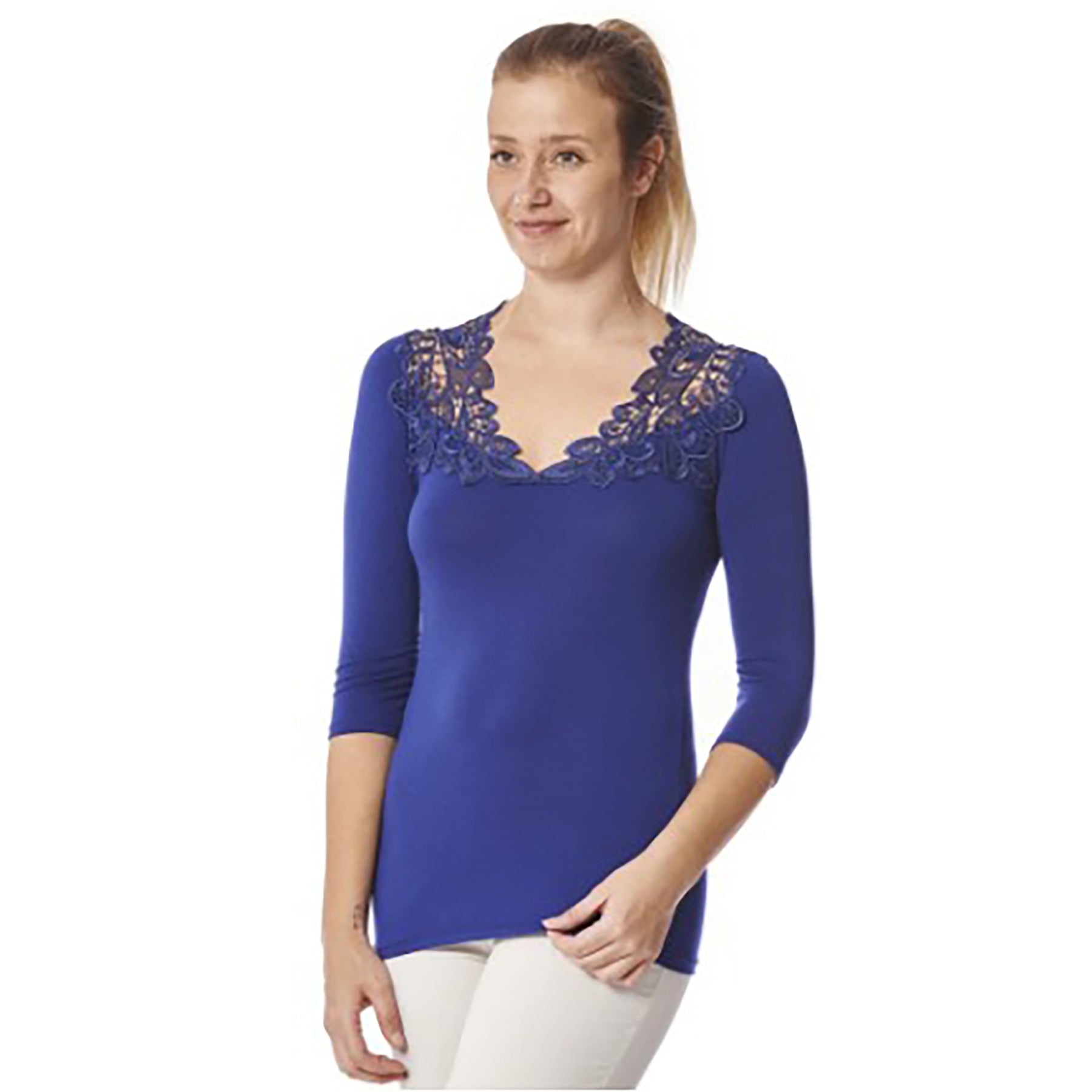 Model wearing navy blue reversible top with 3-4 sleeves and crochet lace neckline detail