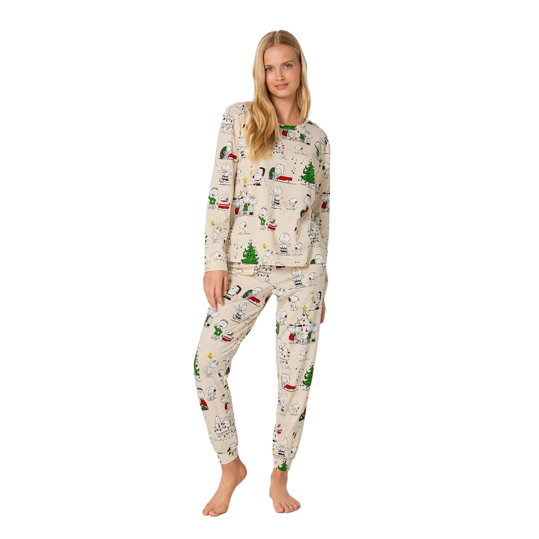 Woman wearing a Christmas-themed pajama set on a white background