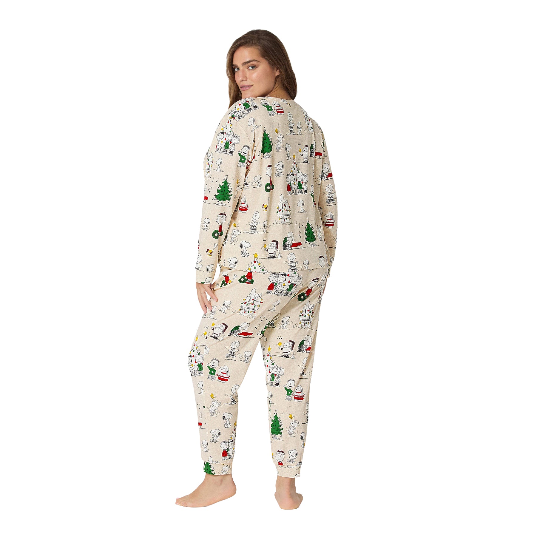 Woman wearing a Christmas-themed onesie on a white background