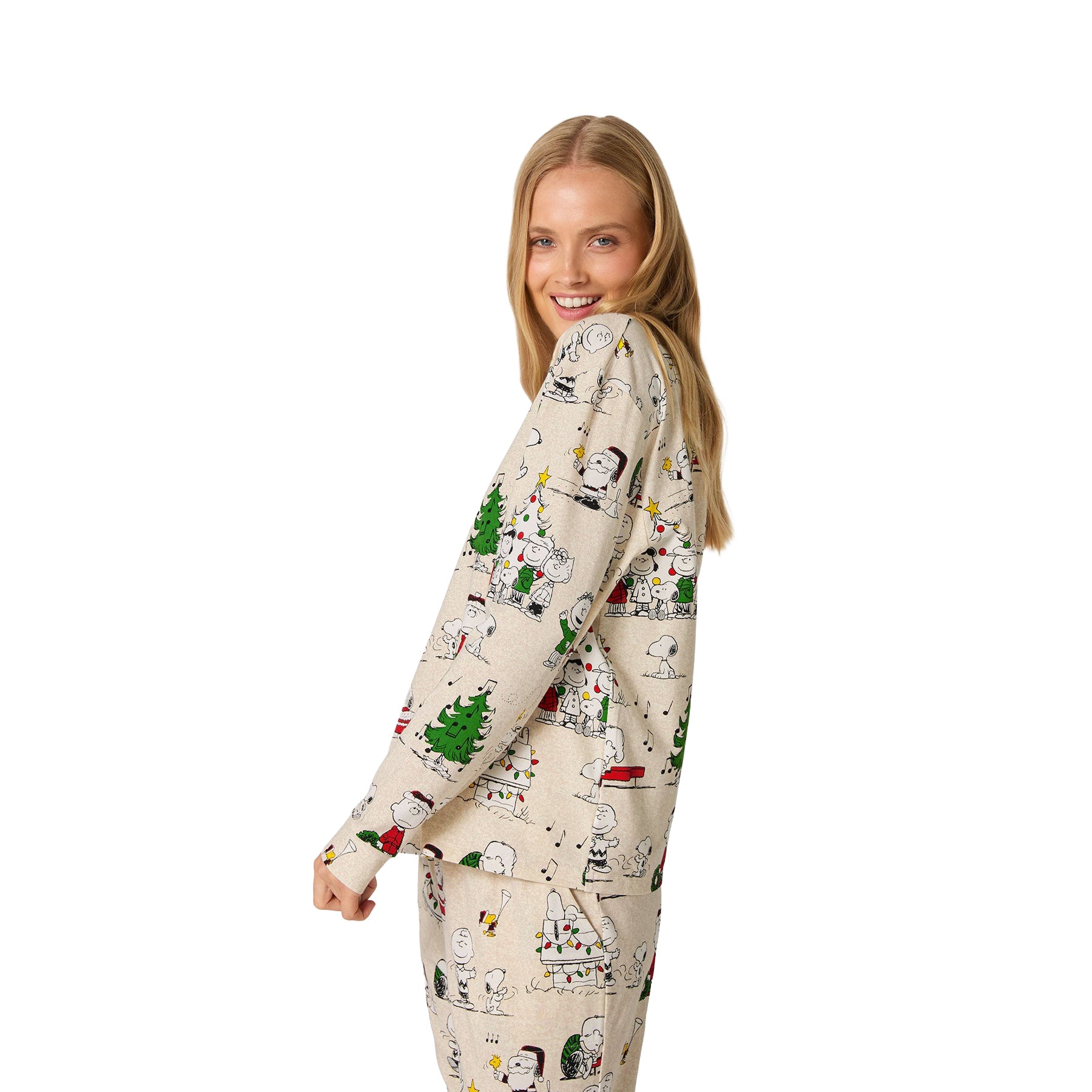 Woman wearing a patterned onesie on a white background