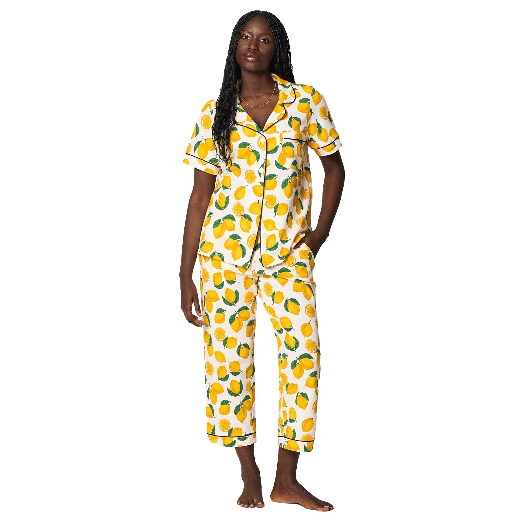 Front view of lemon print pyjama set with cropped pants, short sleeve button-up top, and contrast piping trim.