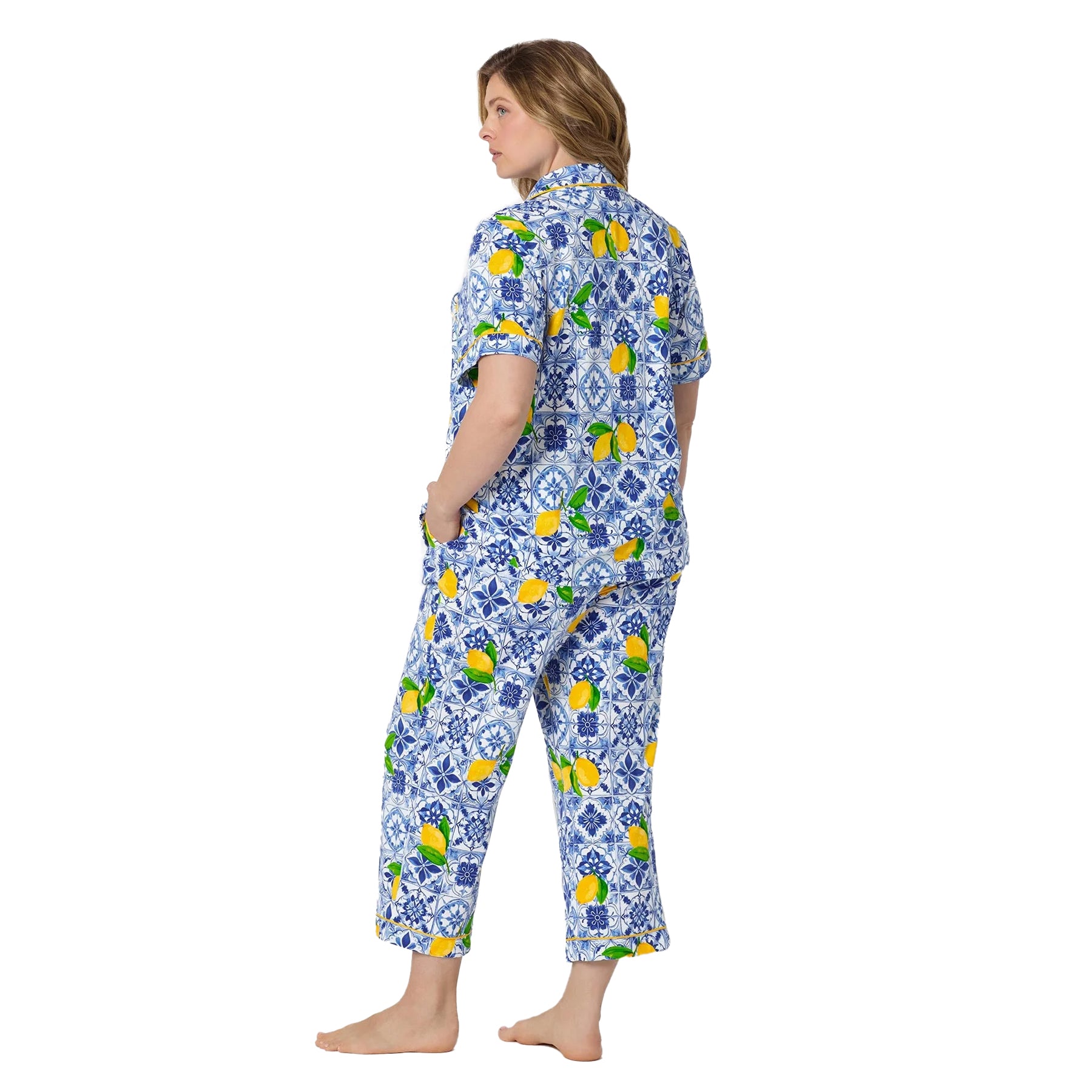 Back angled view of Bed Head pajama PJ set featuring vibrant lemon print, blue tile pattern, and cropped sleep pants.