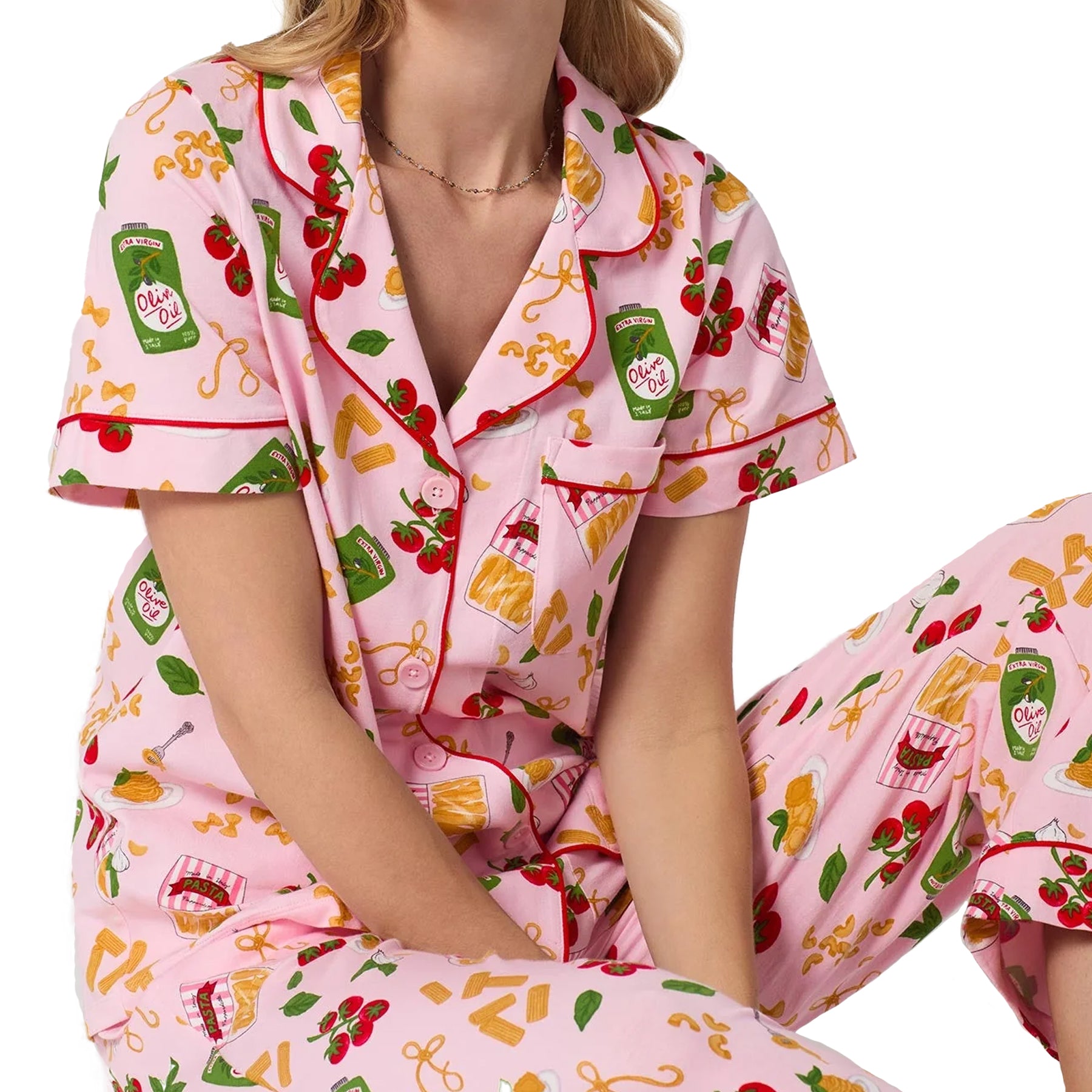 Close-up of Bed Head pasta print pajama top with pink piping, button-front styling, and matching PJ pants.