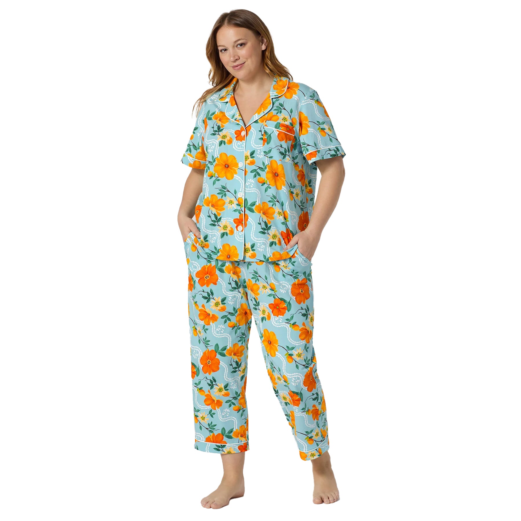 Plus size Bed Head floral pajama PJ set in aqua blue with orange botanical print and cropped pants.