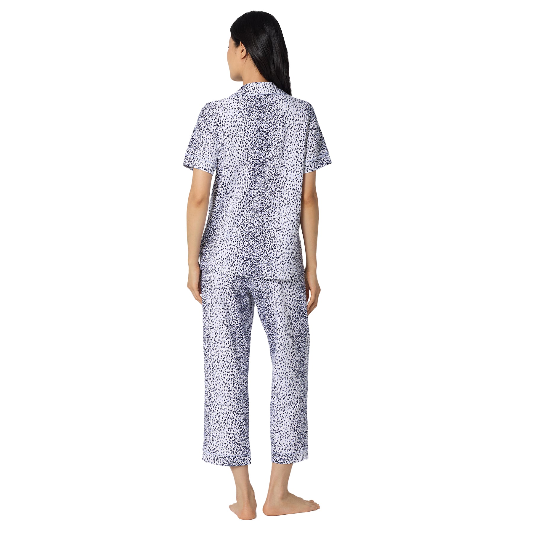 Back view of a white and navy animal print pyjama set with relaxed fit short sleeve top and cropped lounge pants.