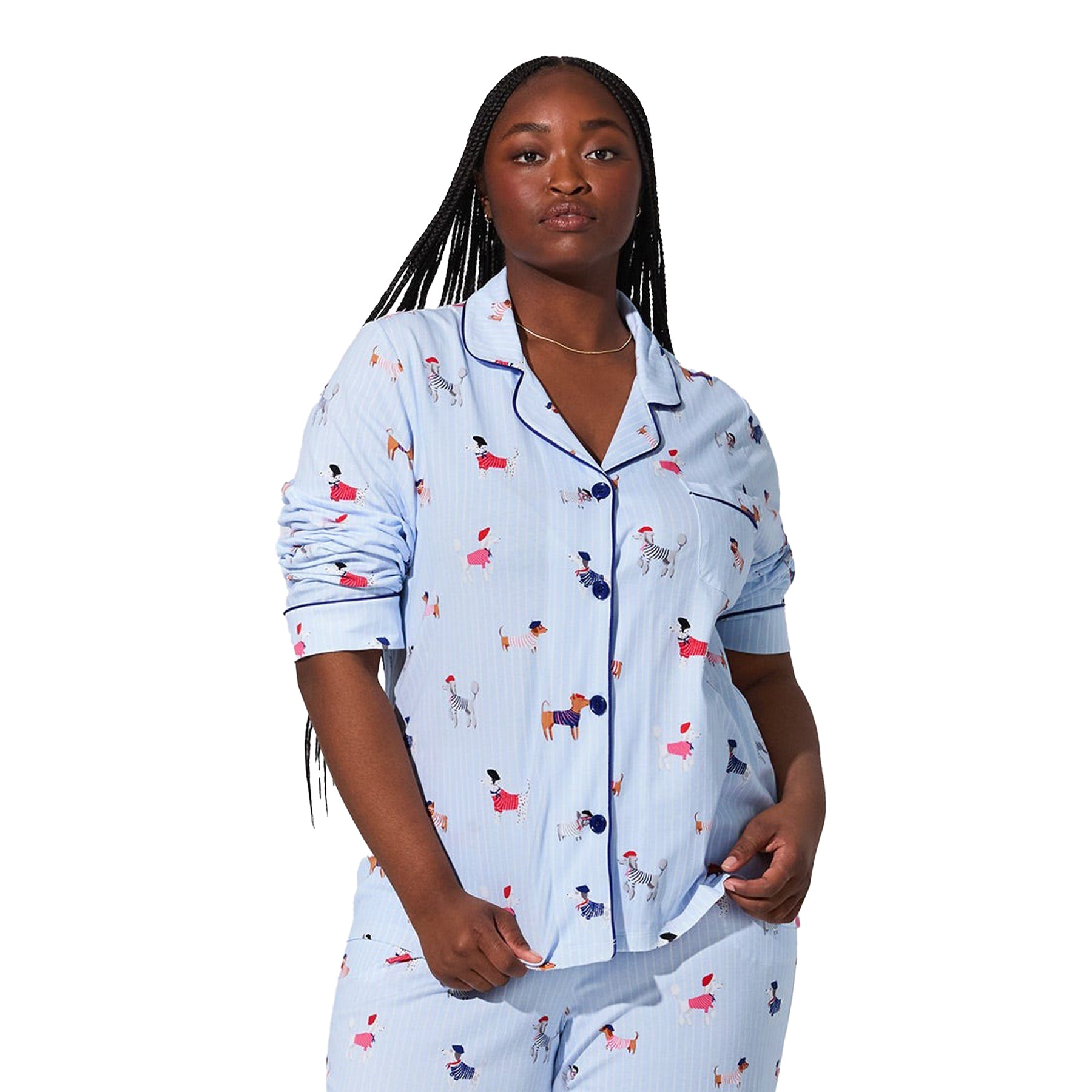 Close-up front view of plus-size model wearing light blue dog-print pyjama set with navy piping