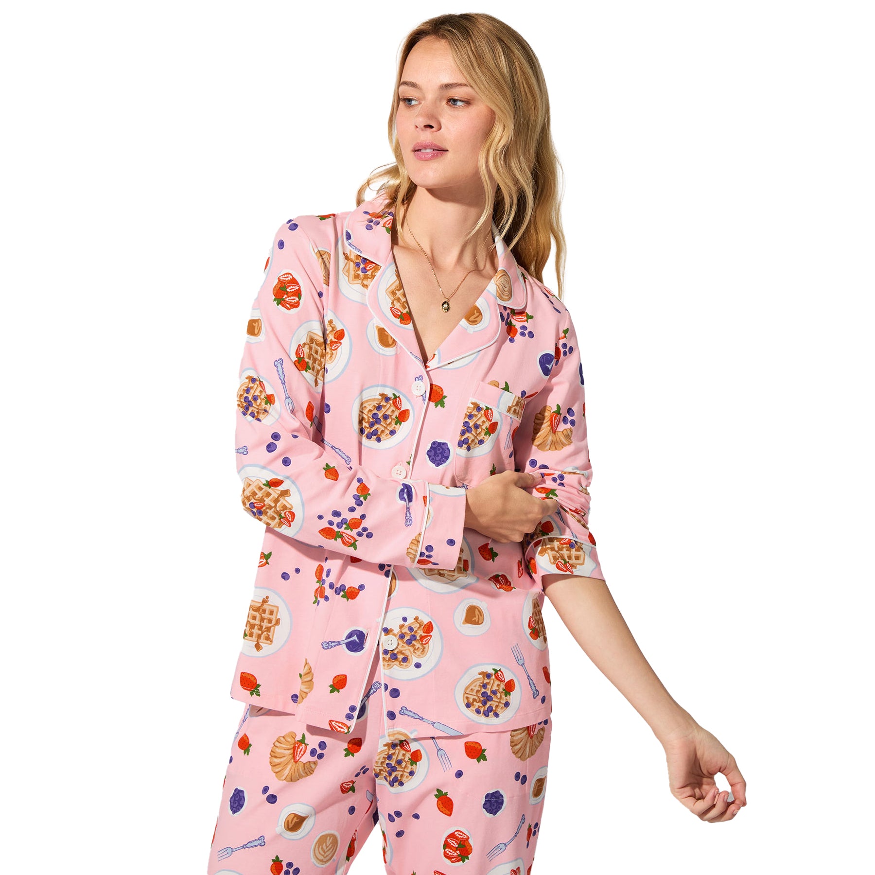 Close-up of pink waffle brunch print pyjama top with button front and piping detail.