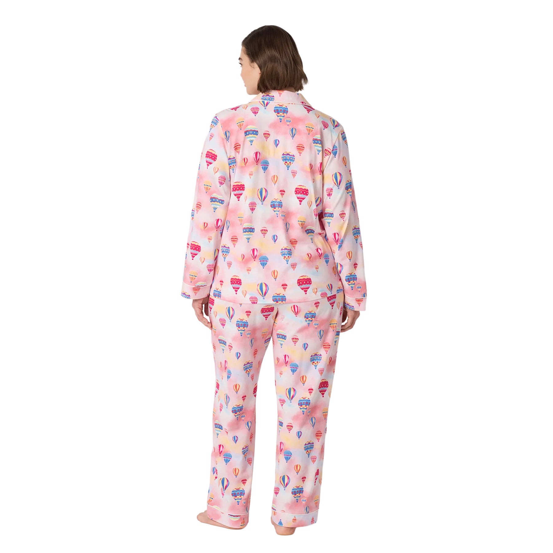 Back view of a plus-size woman wearing a pink hot air balloon print pajama set with long sleeves and full-length pants.