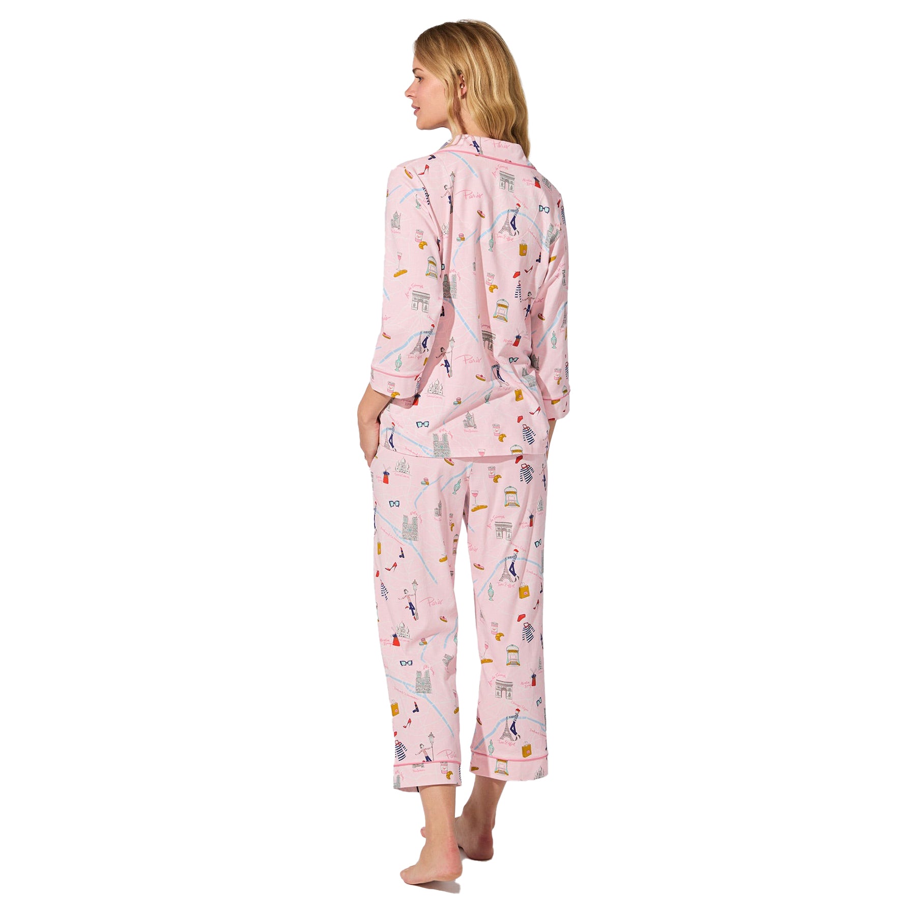 Back view of straight-size model wearing blush pink cropped pajama set with multicolour Parisian print.