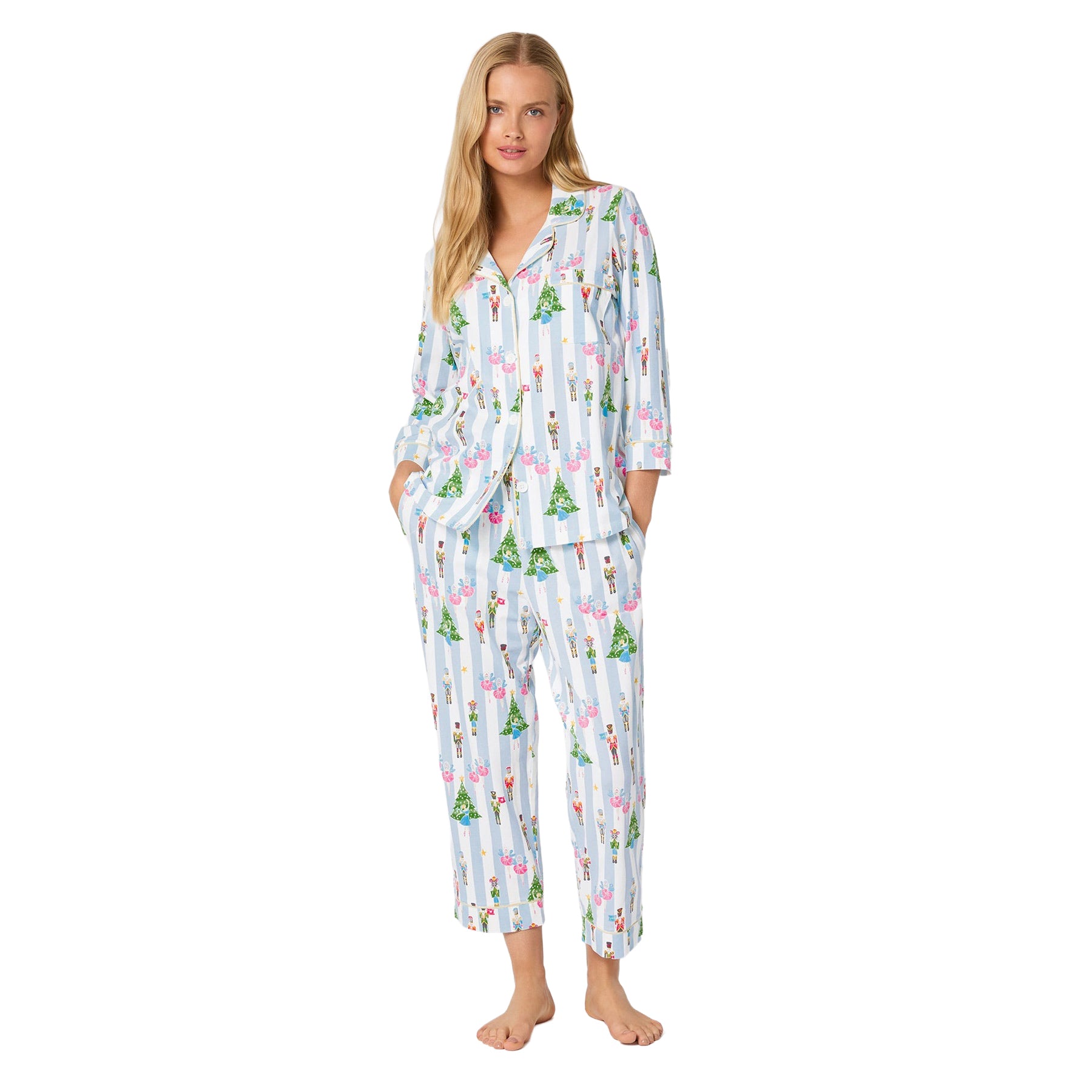 Woman wearing a patterned pajama set on a white background