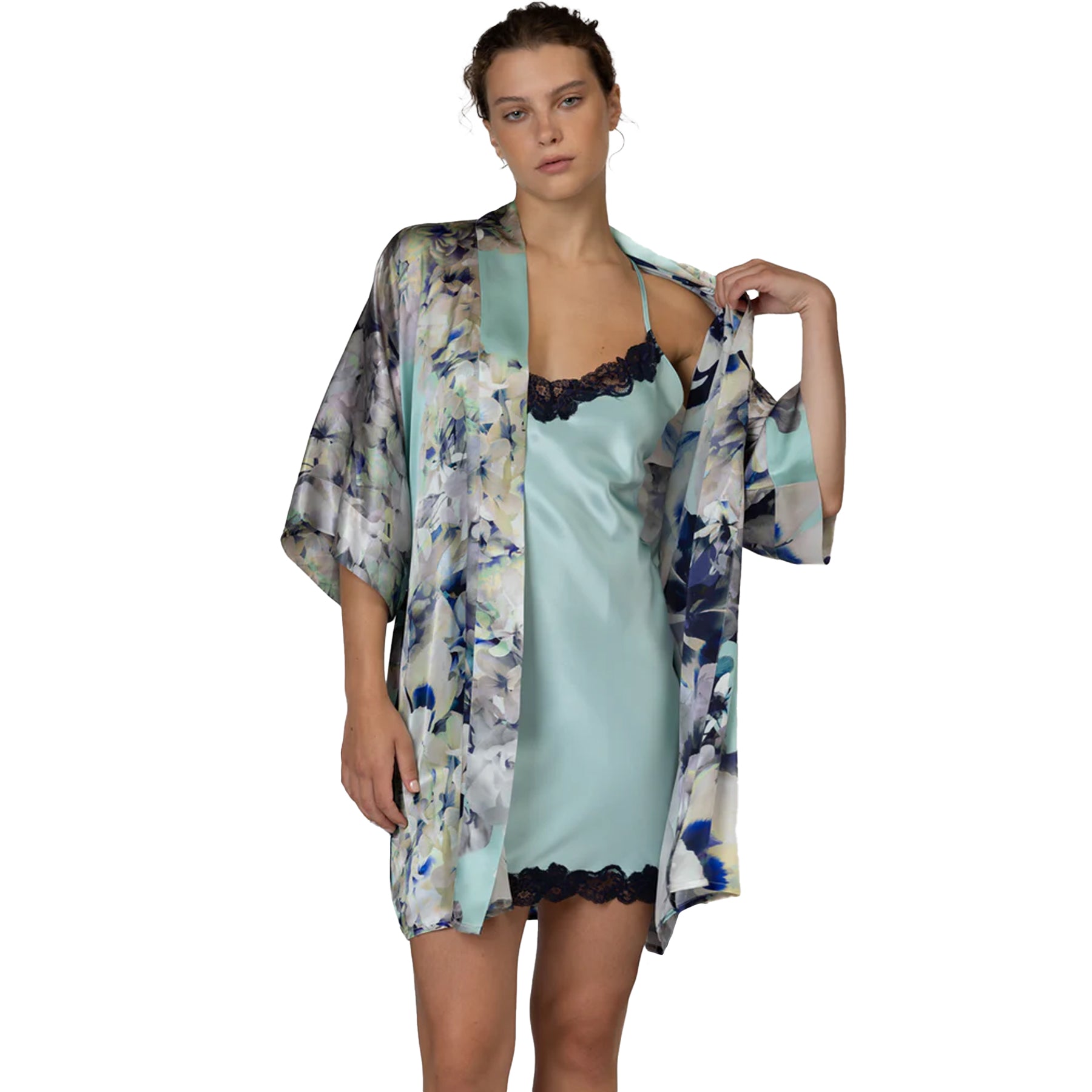 Luxury aquamarine satin chemise paired with a floral print robe and navy lace detailing for elegant lounging.