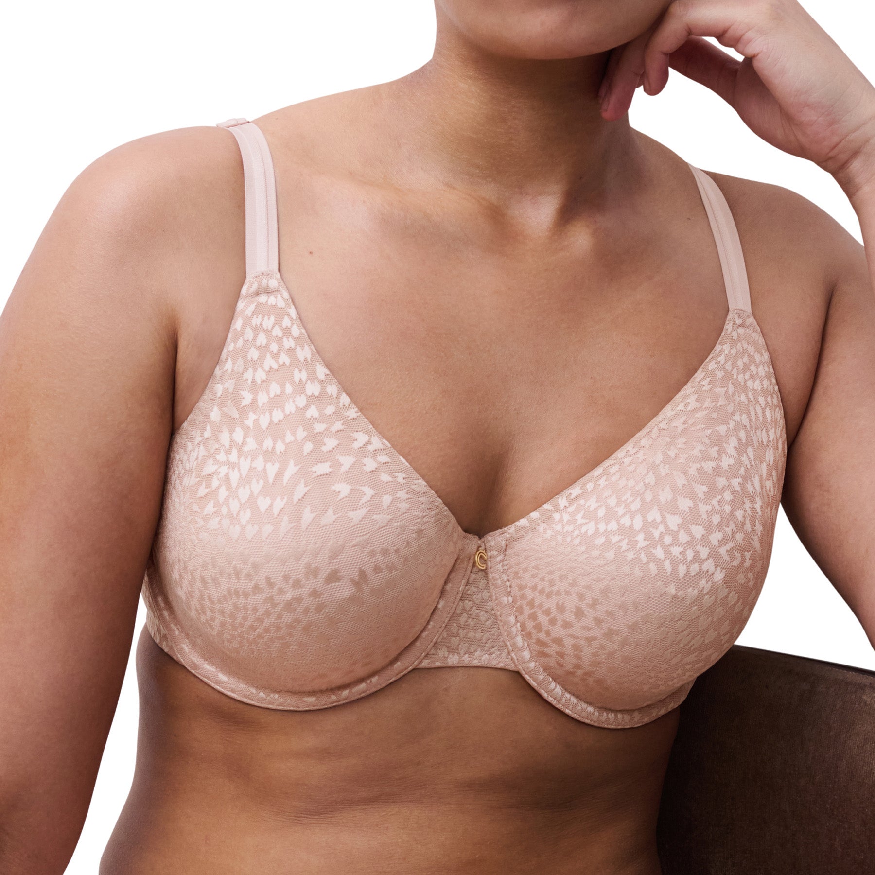 Close-up side view of soft pink jacquard minimizer bra showing support and shaping.