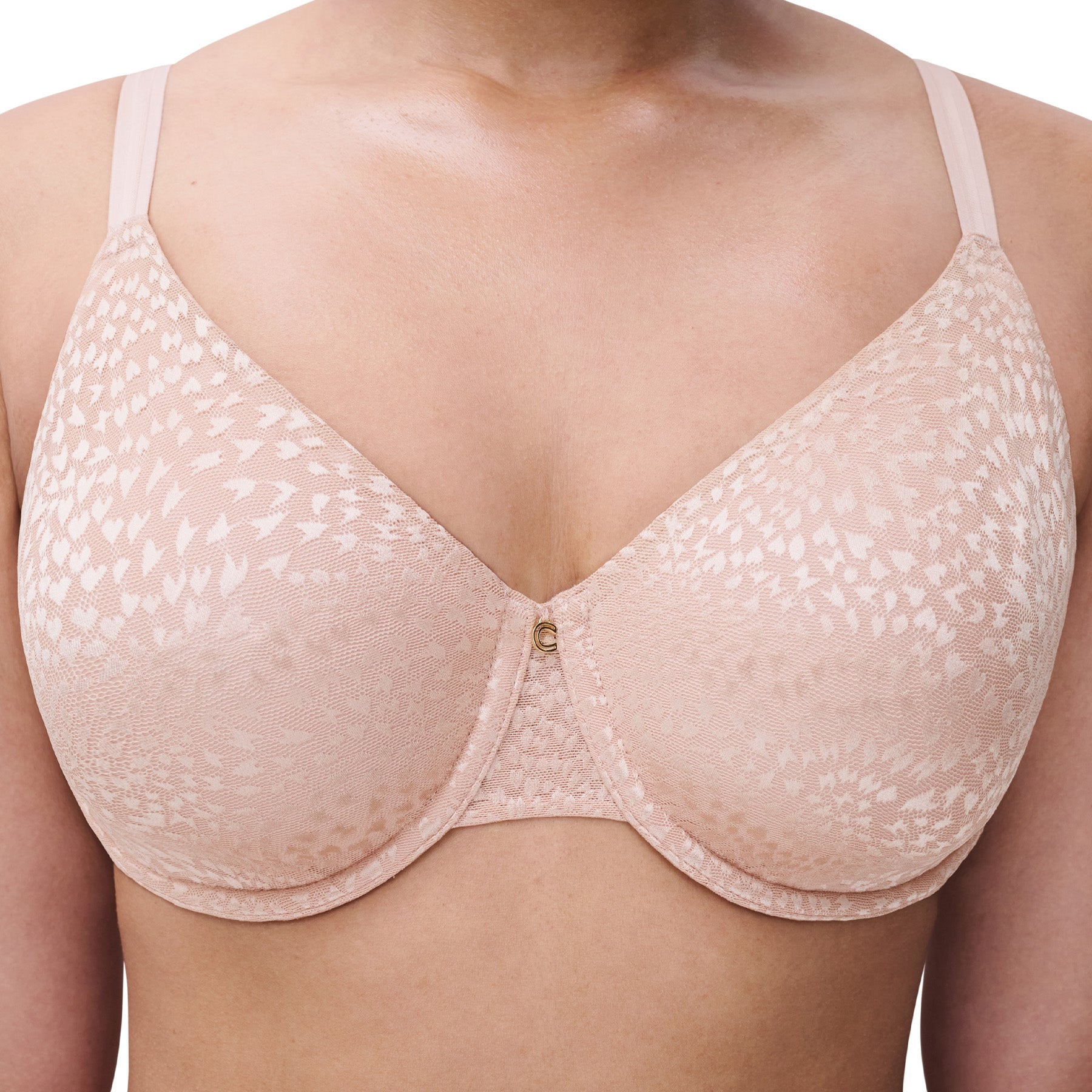 Detailed view of the centre front of soft pink minimizer bra with jacquard texture and gold-tone charm.