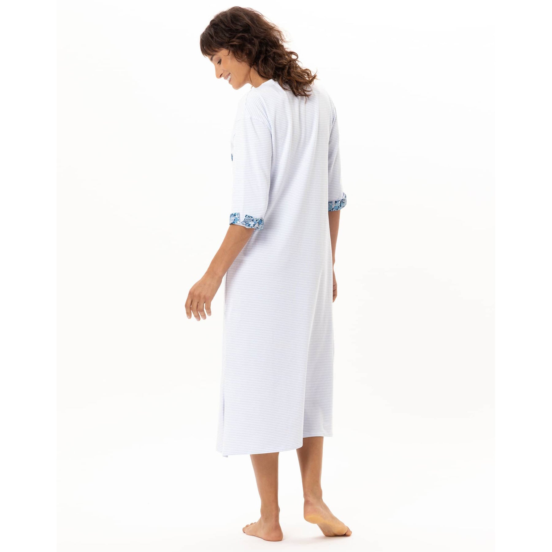 Back view of women’s blue stripe midi cotton nightgown with three-quarter sleeves and floral cuff trim