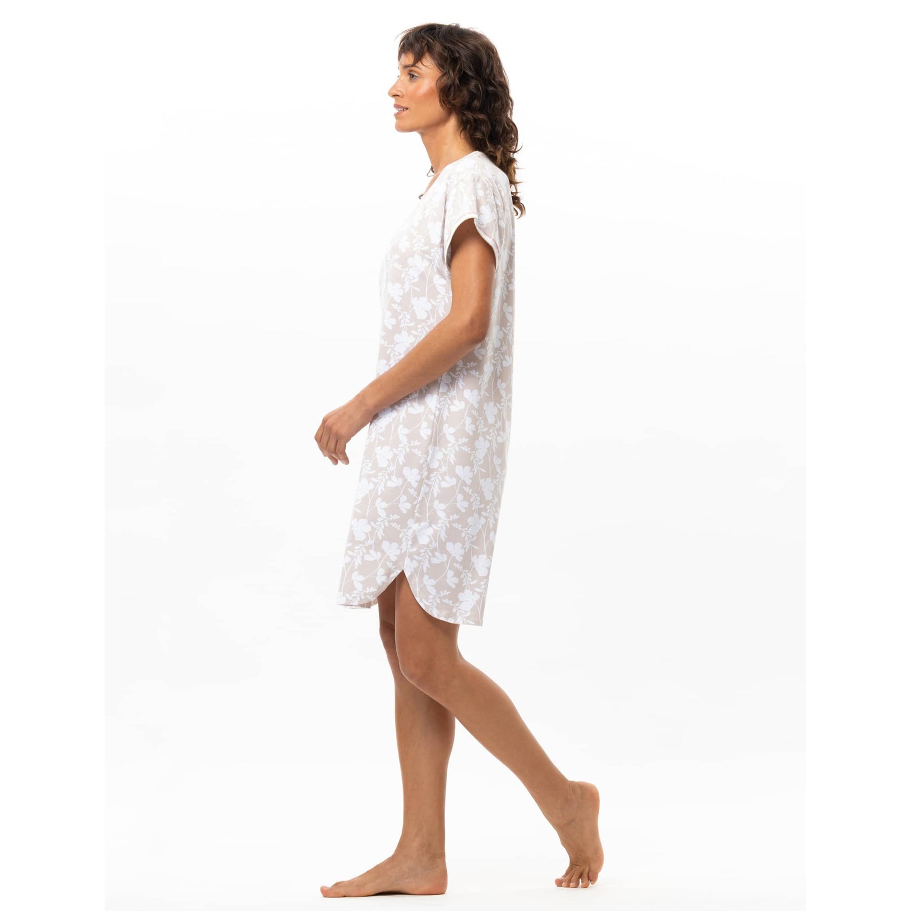 Side view of blanc beige short sleeve sleep dress with rounded hem and floral pattern