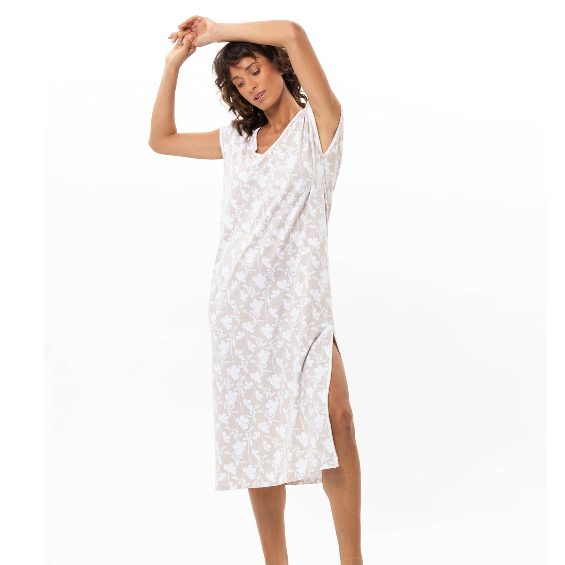 Model wearing beige floral midi nightdress with V-neck and relaxed fit silhouette
