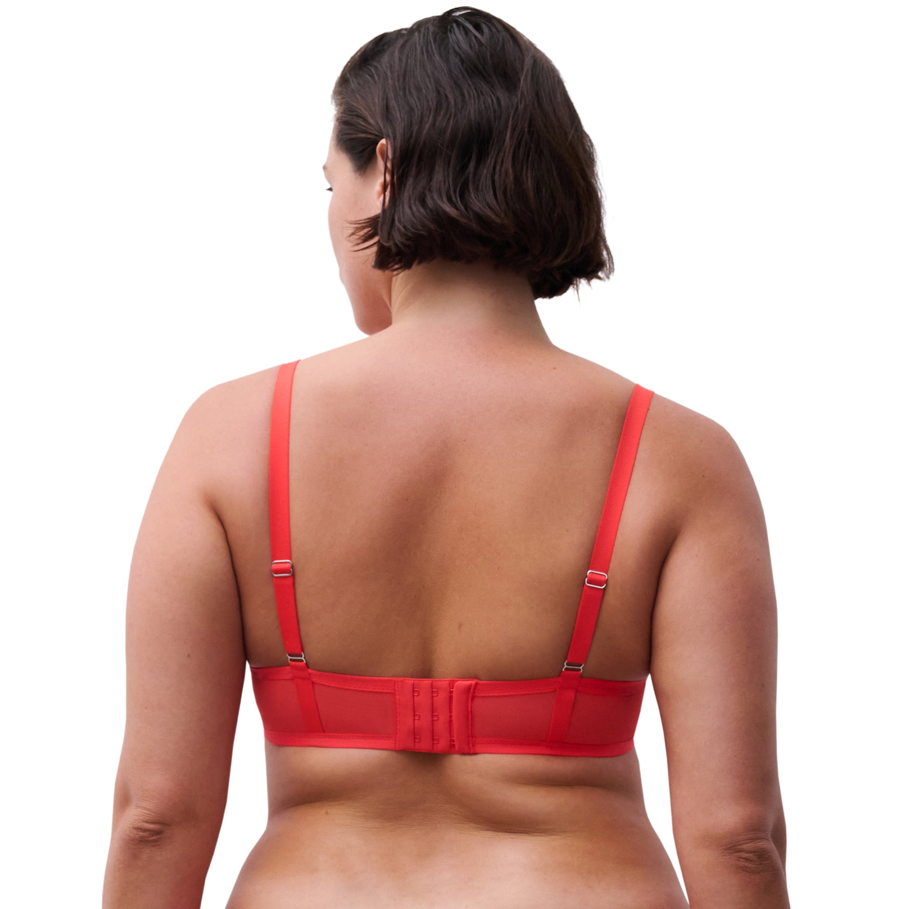 Red bra worn by a person on a white background